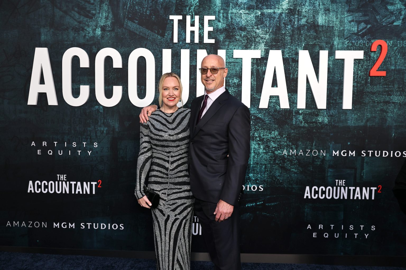HOLLYWOOD, CALIFORNIA - APRIL 16: Producer Lynette Howell Taylor (L) and irector/executive producer Gavin O’Connor seen at the Amazon MGM Studios "The Accountant 2" Los Angeles Premiere at TCL Chinese Theatre on April 16, 2025 in Hollywood, California. (Photo by Eric Charbonneau/Amazon MGM Studios via Getty Images)