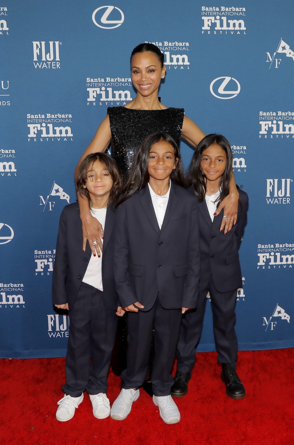 SANTA BARBARA, CALIFORNIA - FEBRUARY 12: Honoree Zoe Saldaña, and her three children, Zen, Cy and Bowie attend the American Riviera Award ceremony during the 40th Santa Barbara International Film Festival at The Arlington Theatre on February 12, 2025 in Santa Barbara, California. (Photo by Tibrina Hobson/Getty Images for Santa Barbara International Film Festival)