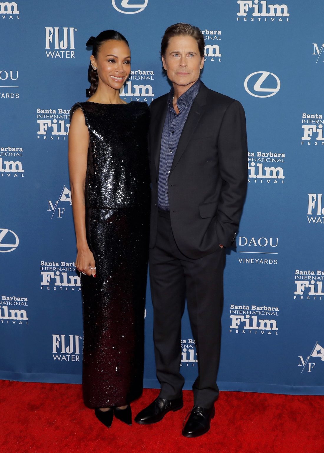 SANTA BARBARA, CALIFORNIA - FEBRUARY 12: Zoe Saldaña and Rob Lowe attend the American Riviera Award during the 40th Santa Barbara International Film Festival on February 12, 2025 in Santa Barbara, California. (Photo by Tibrina Hobson/Getty Images for Santa Barbara International Film Festival)
