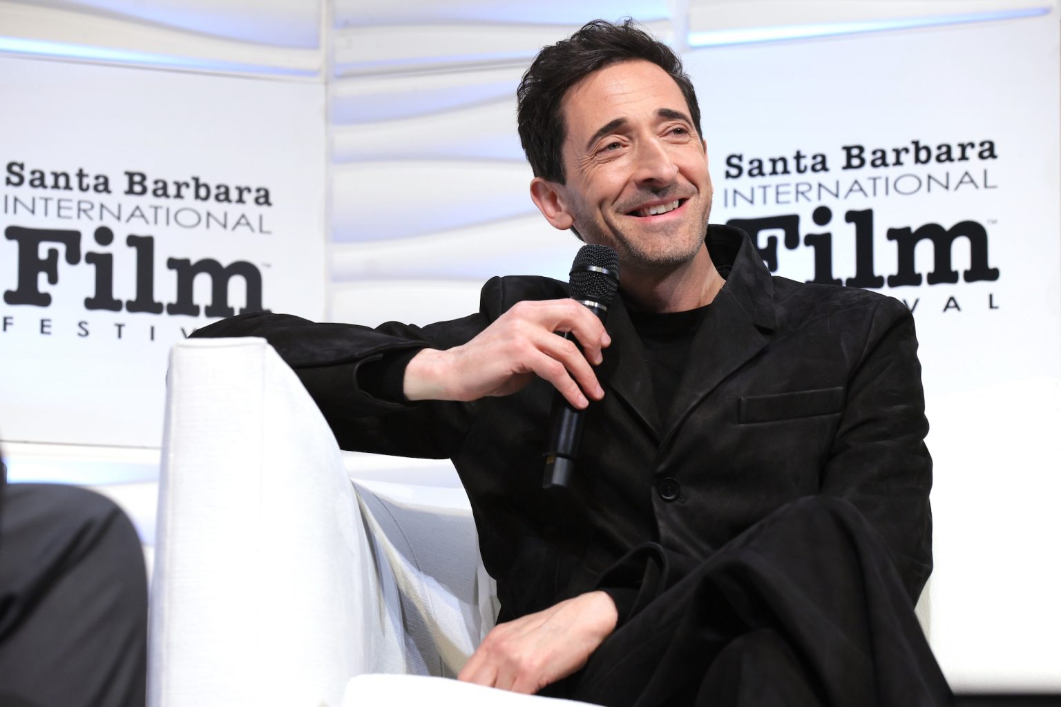 SANTA BARBARA, CALIFORNIA - FEBRUARY 13: Adrien Brody speaks onstage at the Cinema Vanguard Award during the 40th Santa Barbara International Film Festival at The Arlington Theatre on February 13, 2025 in Santa Barbara, California. (Photo by Tibrina Hobson/Getty Images for Santa Barbara International Film Festival)