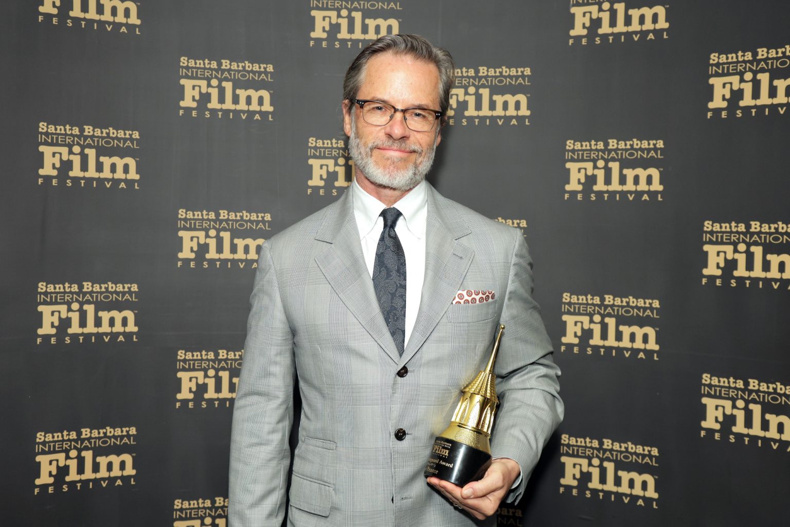 SANTA BARBARA, CALIFORNIA - FEBRUARY 13: Honoree Guy Pearce poses with the Cinema Vanguard Award during the 40th Santa Barbara International Film Festival at The Arlington Theatre on February 13, 2025 in Santa Barbara, California. (Photo by Rebecca Sapp/Getty Images for Santa Barbara International Film Festival)