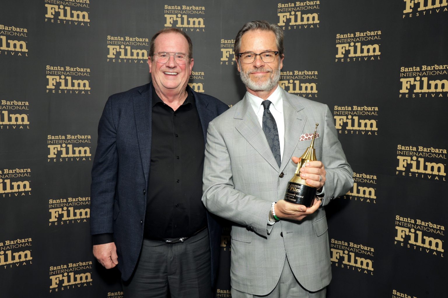 SANTA BARBARA, CALIFORNIA - FEBRUARY 13: (L-R) Pete Hammond and honoree Guy Pearce pose with the Cinema Vanguard Award during the 40th Santa Barbara International Film Festival at The Arlington Theatre on February 13, 2025 in Santa Barbara, California. (Photo by Rebecca Sapp/Getty Images for Santa Barbara International Film Festival)