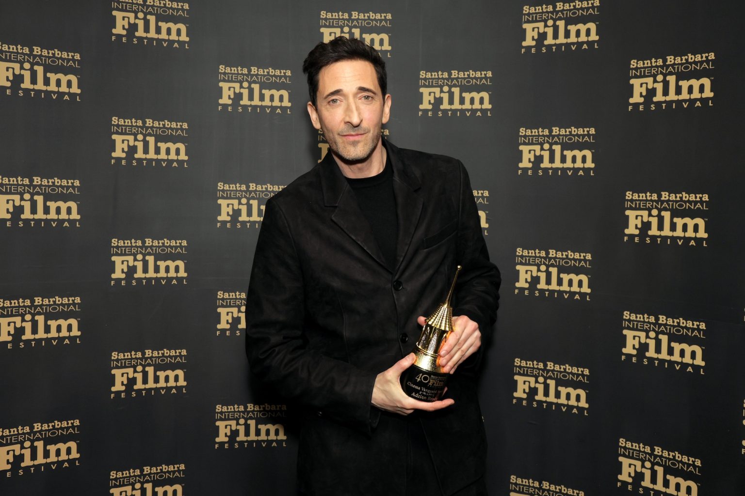 SANTA BARBARA, CALIFORNIA - FEBRUARY 13: Honoree Adrien Brody poses with the Cinema Vanguard Award during the 40th Santa Barbara International Film Festival at The Arlington Theatre on February 13, 2025 in Santa Barbara, California. (Photo by Rebecca Sapp/Getty Images for Santa Barbara International Film Festival)