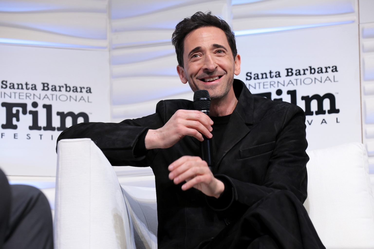 SANTA BARBARA, CALIFORNIA - FEBRUARY 13: Adrien Brody speaks onstage at the Cinema Vanguard Award during the 40th Santa Barbara International Film Festival at The Arlington Theatre on February 13, 2025 in Santa Barbara, California. (Photo by Tibrina Hobson/Getty Images for Santa Barbara International Film Festival)