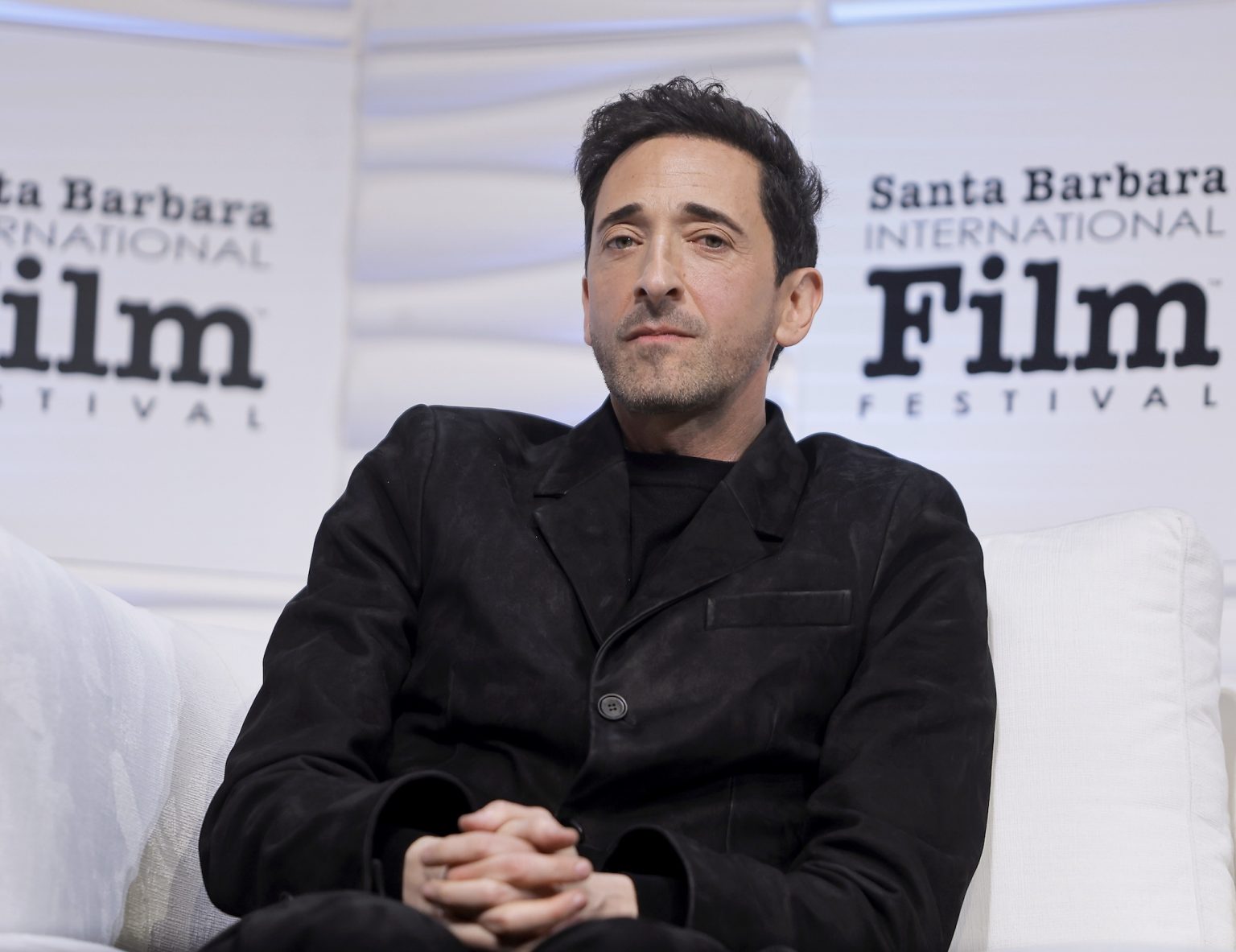 SANTA BARBARA, CALIFORNIA - FEBRUARY 13: Adrien Brody speaks onstage at the Cinema Vanguard Award during the 40th Santa Barbara International Film Festival at The Arlington Theatre on February 13, 2025 in Santa Barbara, California. (Photo by Tibrina Hobson/Getty Images for Santa Barbara International Film Festival)