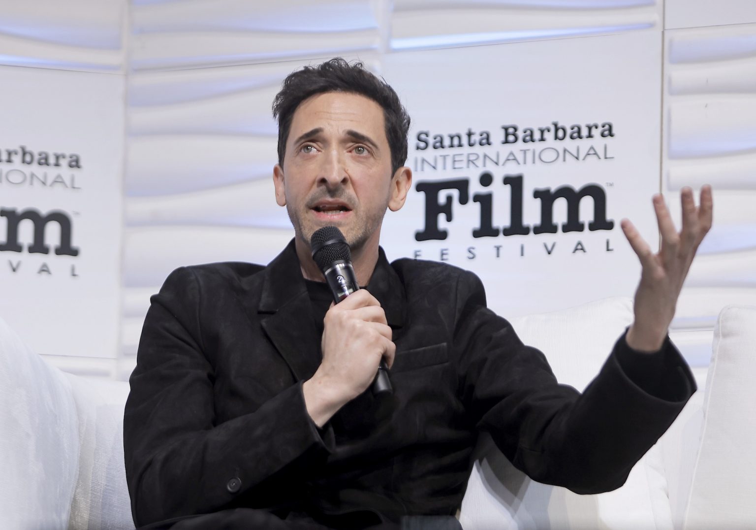 SANTA BARBARA, CALIFORNIA - FEBRUARY 13: Adrien Brody speaks onstage at the Cinema Vanguard Award during the 40th Santa Barbara International Film Festival at The Arlington Theatre on February 13, 2025 in Santa Barbara, California. (Photo by Tibrina Hobson/Getty Images for Santa Barbara International Film Festival)