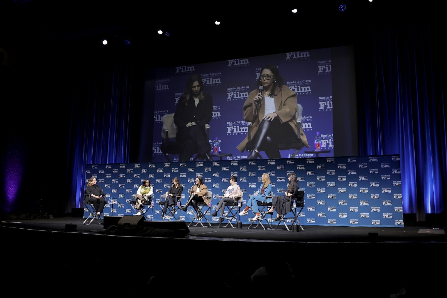 SANTA BARBARA, CALIFORNIA - FEBRUARY 15: (L-R) Madelyn Hammond, Suchitra Mattai, Emily Kassie, Smriti Mundhra, Diane Warren, Victoria Warmerdam and Paula DuPré Pesmen speak onstage at the Women's Panel durning the 40th Santa Barbara International Film Fest on February 15, 2025 in Santa Barbara, California. (Photo by Tibrina Hobson/Getty Images for Santa Barbara International Film Festival)