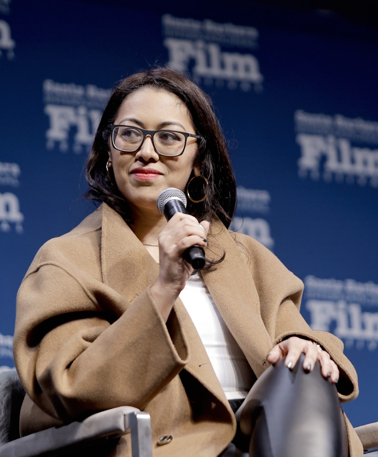 SANTA BARBARA, CALIFORNIA - FEBRUARY 15: Smriti Mundhra speaks onstage at the Women's Panel durning the 40th Santa Barbara International Film Fest on February 15, 2025 in Santa Barbara, California. (Photo by Tibrina Hobson/Getty Images for Santa Barbara International Film Festival)