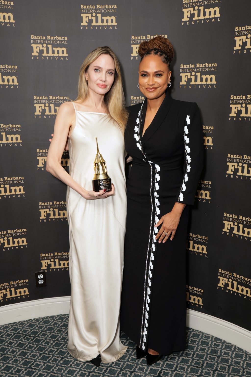 SANTA BARBARA, CALIFORNIA - FEBRUARY 05: Honoree Angelina Jolie and Ava DuVernay pose with the Maltin Modern Master Award during the 40th Santa Barbara International Film Festival at on February 05, 2025 in Santa Barbara, California. (Photo by Rebecca Sapp/Getty Images for Santa Barbara International Film Festival)