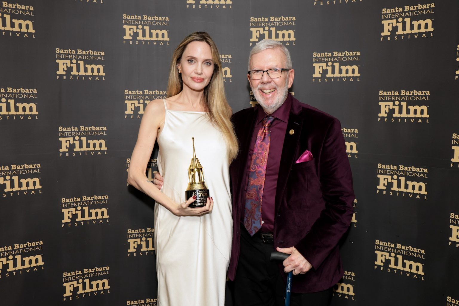 SANTA BARBARA, CALIFORNIA - FEBRUARY 05: Honoree Angelina Jolie and Leonard Maltin pose with the Maltin Modern Master Award during the 40th Santa Barbara International Film Festival at on February 05, 2025 in Santa Barbara, California. (Photo by Rebecca Sapp/Getty Images for Santa Barbara International Film Festival)