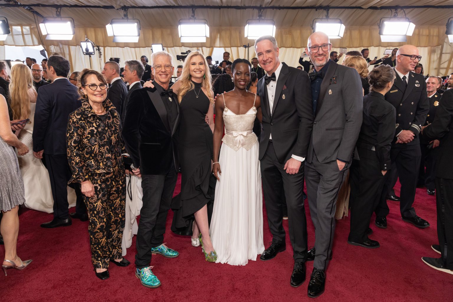 Chris Sanders, Lupita Nyong’o, Jeff Hermann, Christian Davin and guests arrive on the red carpet of the 97th Oscars® at the Dolby® Theatre at Ovation Hollywood on Sunday, March 2, 2025.