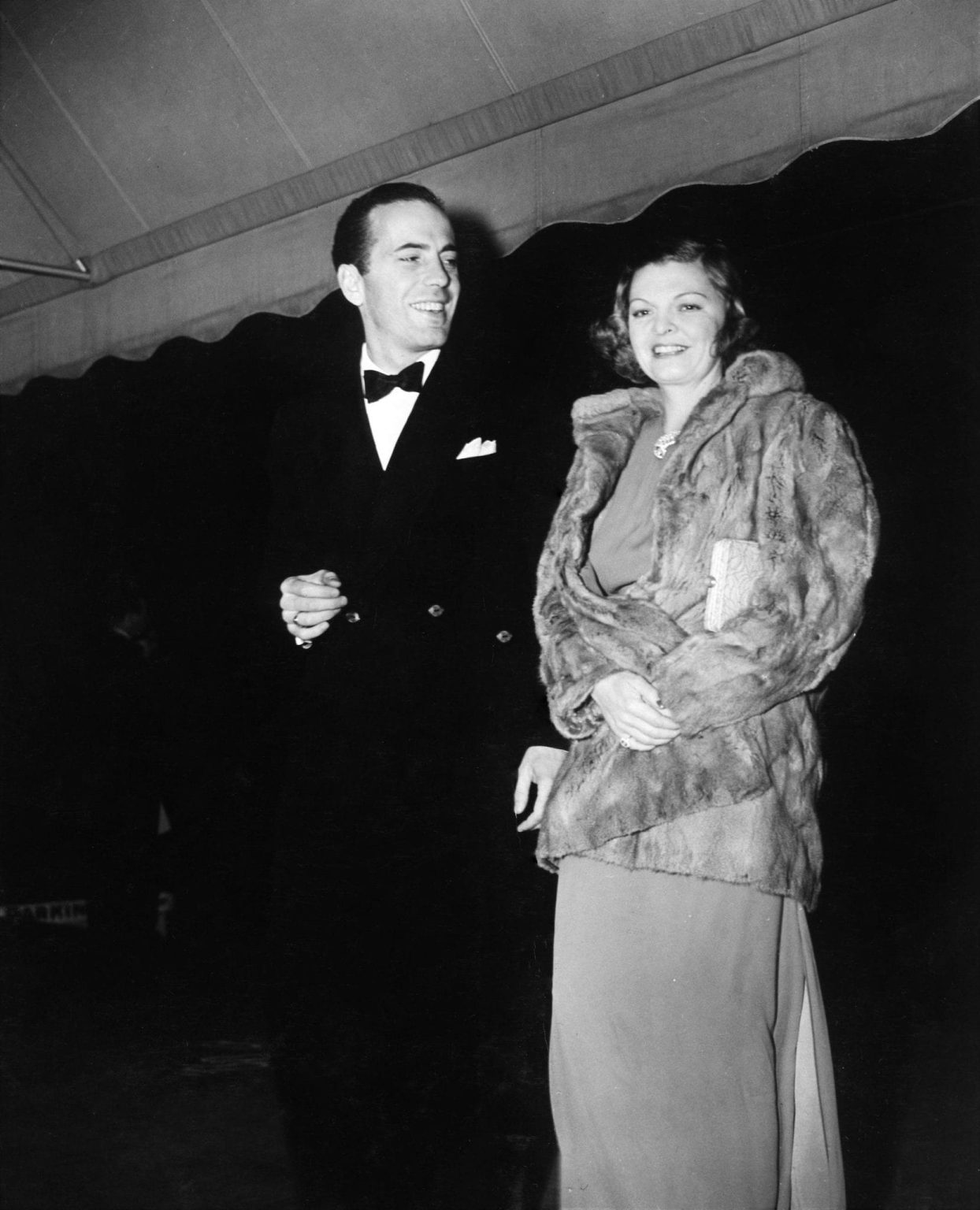 HUMPHREY BOGART and MAYO METHOT at the 35th Anniversary Party of the original Hollywood Hotel promoting the new Warner Bros. film HOLLYWOOD HOTEL in December 1937