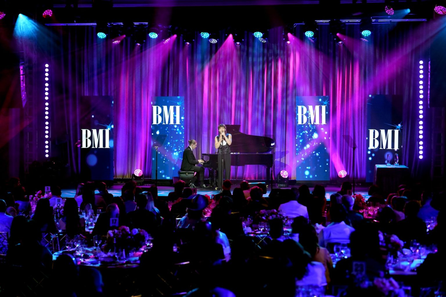 BEVERLY HILLS, CALIFORNIA - MAY 13: Benson Boone (R) performs onstage during the 2025 BMI Pop Awards at Beverly Wilshire, A Four Seasons Hotel, on May 13, 2025 in Beverly Hills, California. (Photo by JC Olivera/Getty Images for BMI)