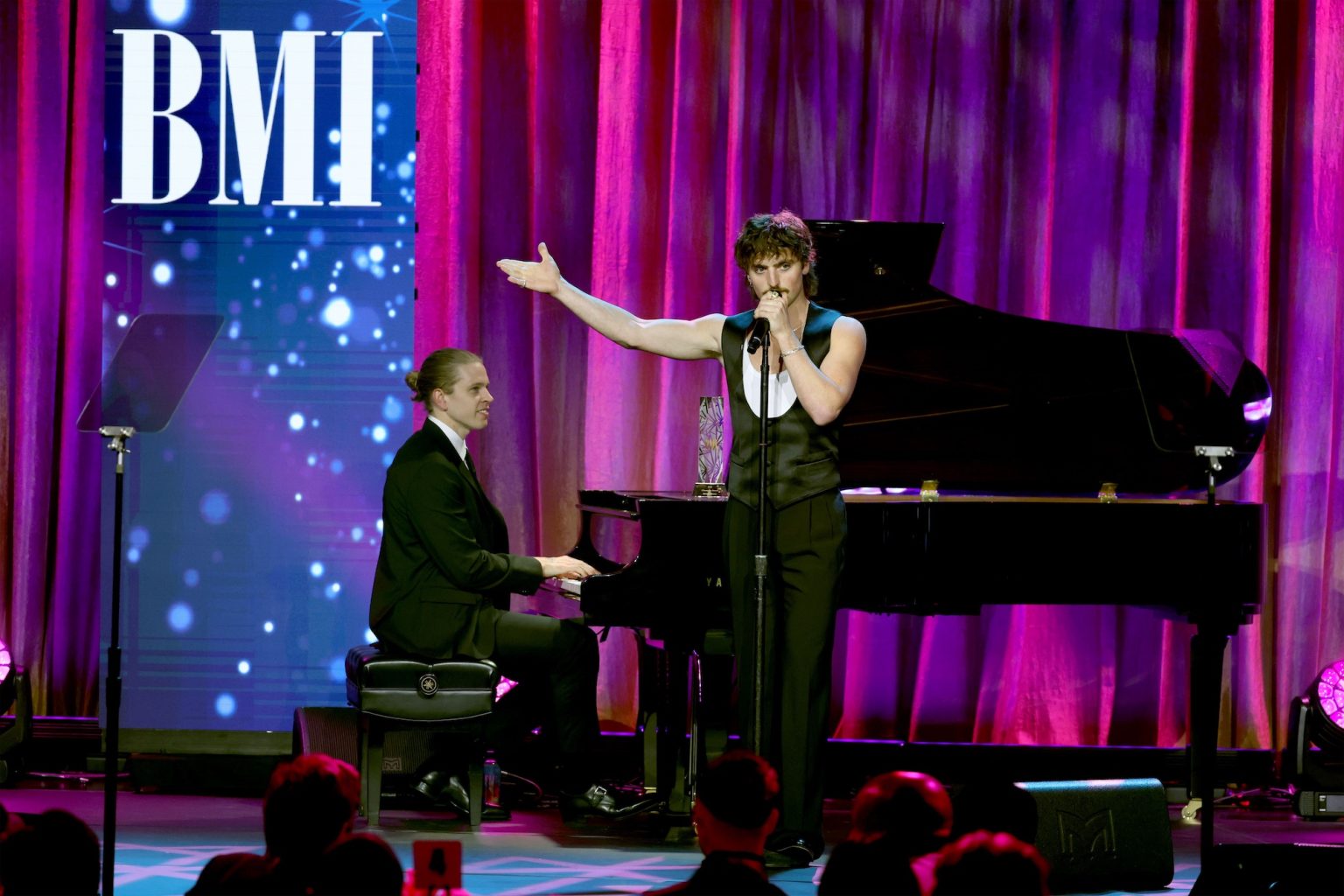 BEVERLY HILLS, CALIFORNIA - MAY 13: Benson Boone (R) performs onstage during the 2025 BMI Pop Awards at Beverly Wilshire, A Four Seasons Hotel, on May 13, 2025 in Beverly Hills, California. (Photo by JC Olivera/Getty Images for BMI)