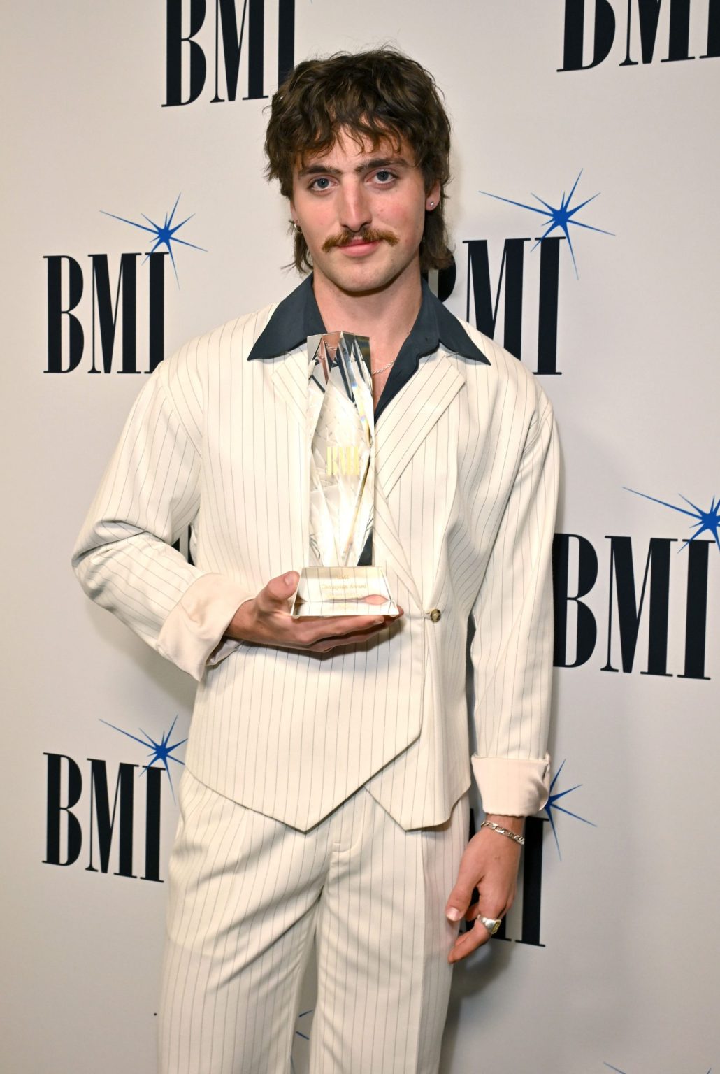 BEVERLY HILLS, CALIFORNIA - MAY 13: BMI Champion Award Honoree Benson Boone attends the 2025 BMI Pop Awards at Beverly Wilshire, A Four Seasons Hotel on May 13, 2025 in Beverly Hills, California. (Photo by Lester Cohen/Getty Images for BMI)