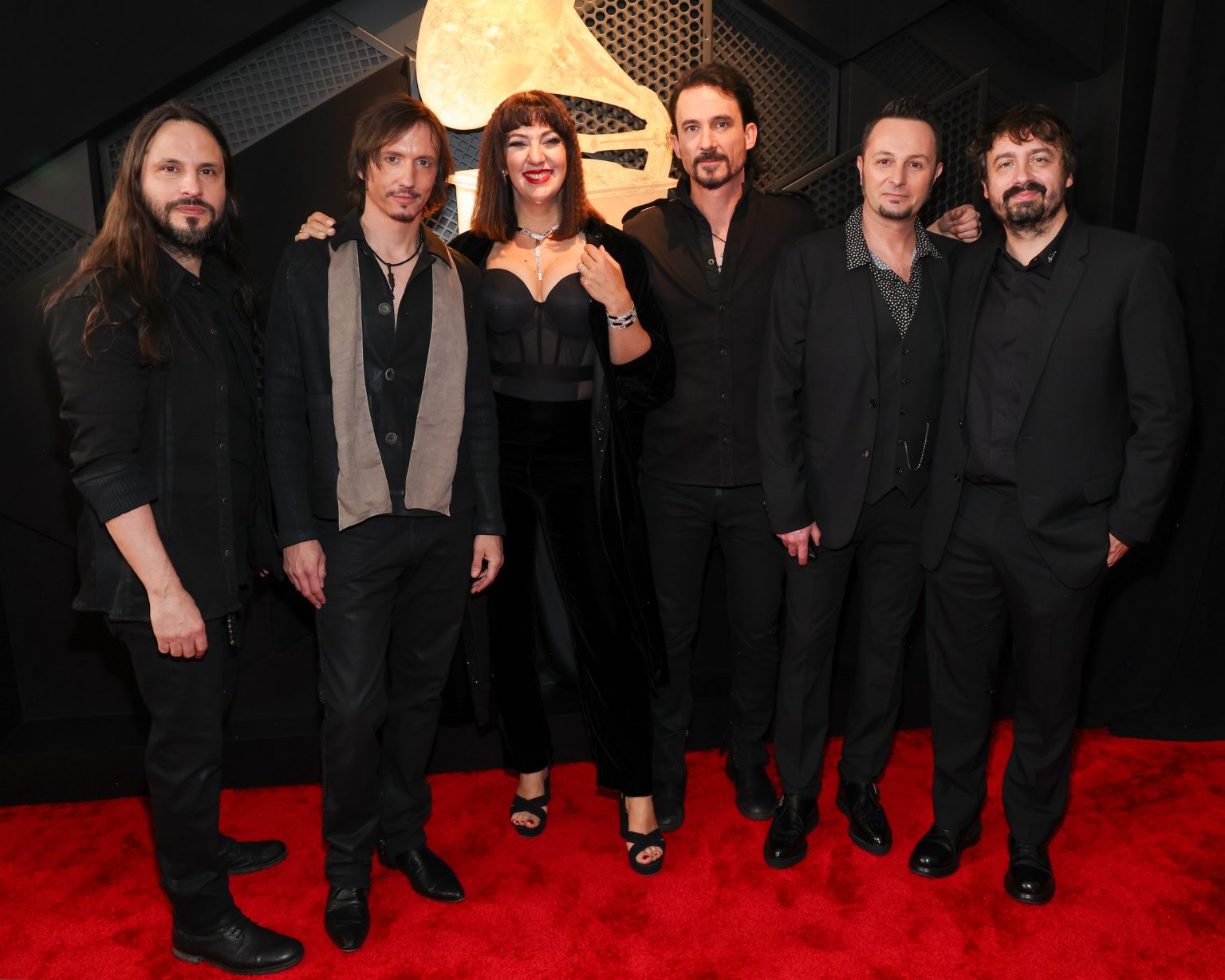 LOS ANGELES, CALIFORNIA - FEBRUARY 02: Christian Andreu, Mario Duplantier, Joe Duplantier, Jean-Michel Labadie of Gojira pose with guests during the 67th Annual GRAMMY Awards at Crypto.com Arena on February 02, 2025 in Los Angeles, California. (Photo by Kevin Mazur/Getty Images for The Recording Academy)