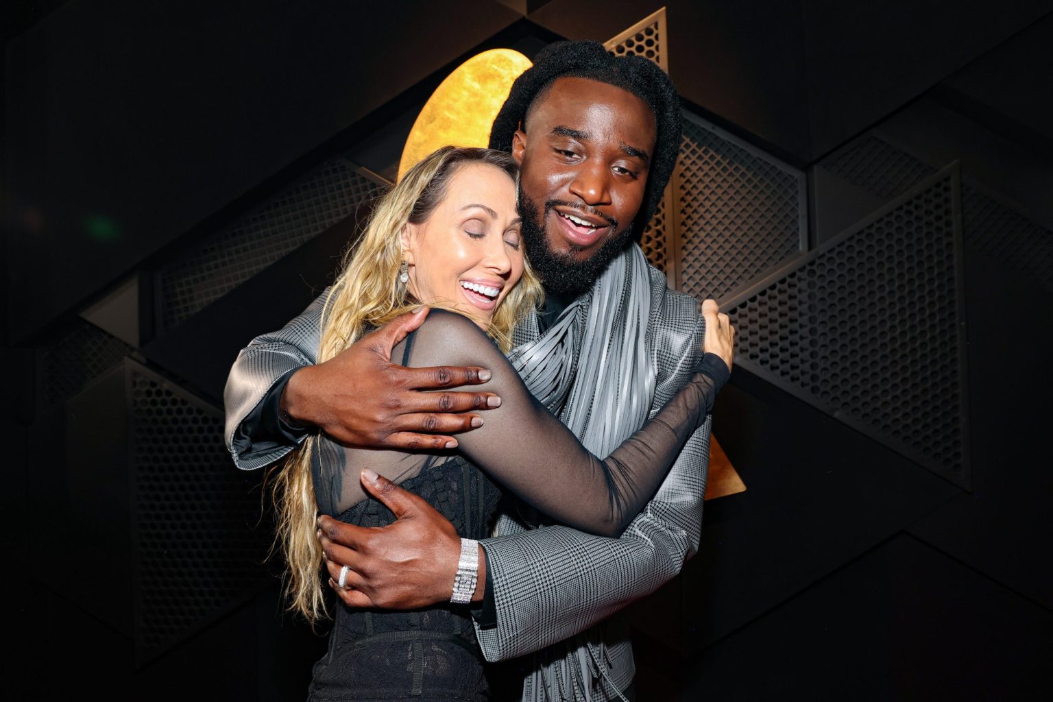 LOS ANGELES, CALIFORNIA - FEBRUARY 02: (L-R) Tish Cyrus and Shaboozey attend the 67th Annual GRAMMY Awards at Crypto.com Arena on February 02, 2025 in Los Angeles, California. (Photo by Kevin Mazur/Getty Images for The Recording Academy)