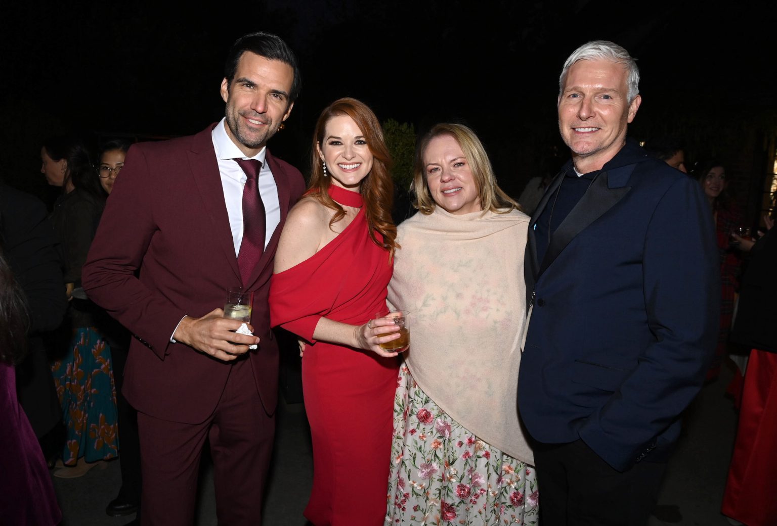 TARRYTOWN, NEW YORK - OCTOBER 17: (L-R) Benjamin Ayres, Sarah Drew, EVP of programming, Hallmark, Lisa Hamilton Daly, and SVP of talent engagement and strategy, Hallmark, Jason Wood attend Hallmark Media's Channel's "Countdown To Christmas" party at Blue Hill at Stone Barns on October 17, 2024 in Tarrytown, New York. (Photo by Dave Kotinsky/Getty Images for Hallmark Media)