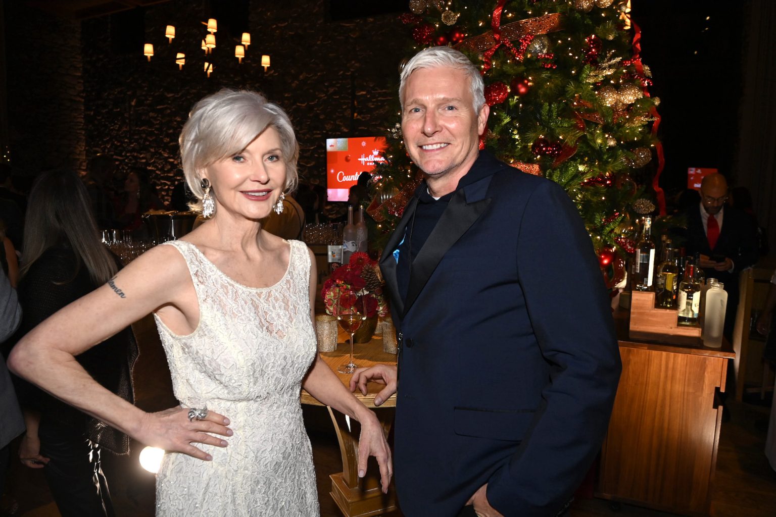 TARRYTOWN, NEW YORK - OCTOBER 17: (L-R) Beth Broderick and SVP of Talent Engagement and Strategy, Hallmark, Jason Wood, attend Hallmark Media's Channel's "Countdown To Christmas" party at Blue Hill at Stone Barns on October 17, 2024 in Tarrytown, New York. (Photo by Dave Kotinsky/Getty Images for Hallmark Media)