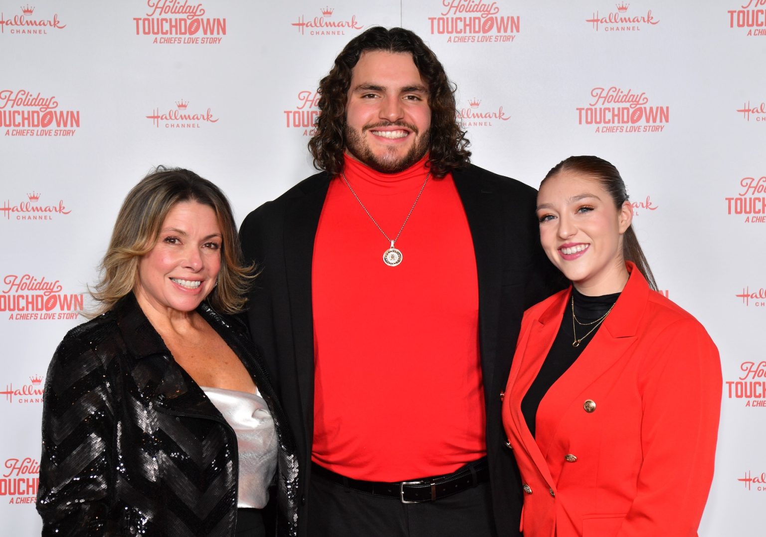 KANSAS CITY, MISSOURI - NOVEMBER 30: Hunter Nourzad (C) and Sarah Christina Kane (R) attend Hallmark's Premiere Screening of Holiday Touchdown: A Chiefs Love Story on November 30, 2024 in Kansas City, Missouri. (Photo by Jason Davis/Getty Images for Hallmark Media)