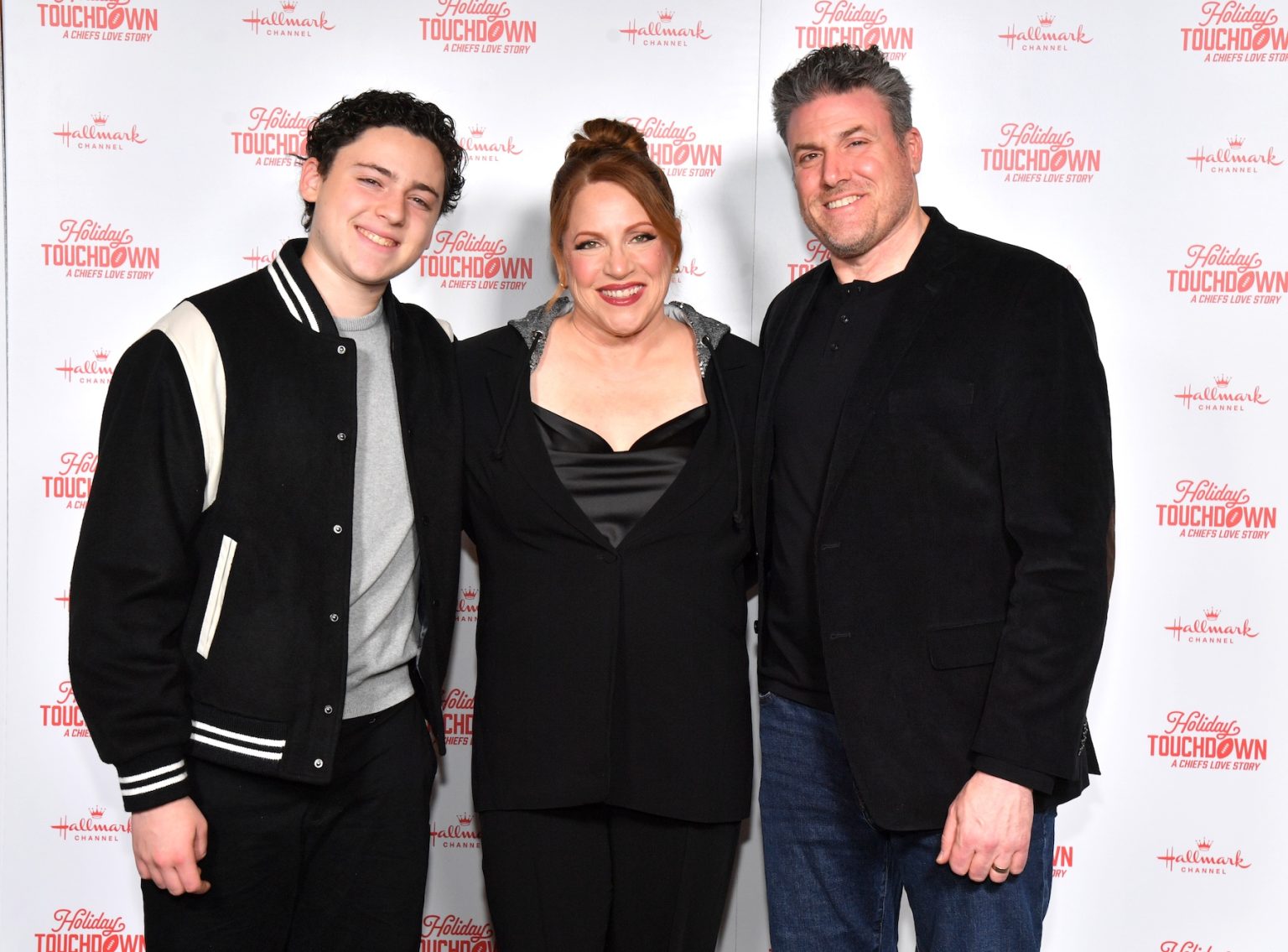 KANSAS CITY, MISSOURI - NOVEMBER 30: Julie Sherman Wolfe (C) attends Hallmark's Premiere Screening of Holiday Touchdown: A Chiefs Love Story on November 30, 2024 in Kansas City, Missouri. (Photo by Jason Davis/Getty Images for Hallmark Media)