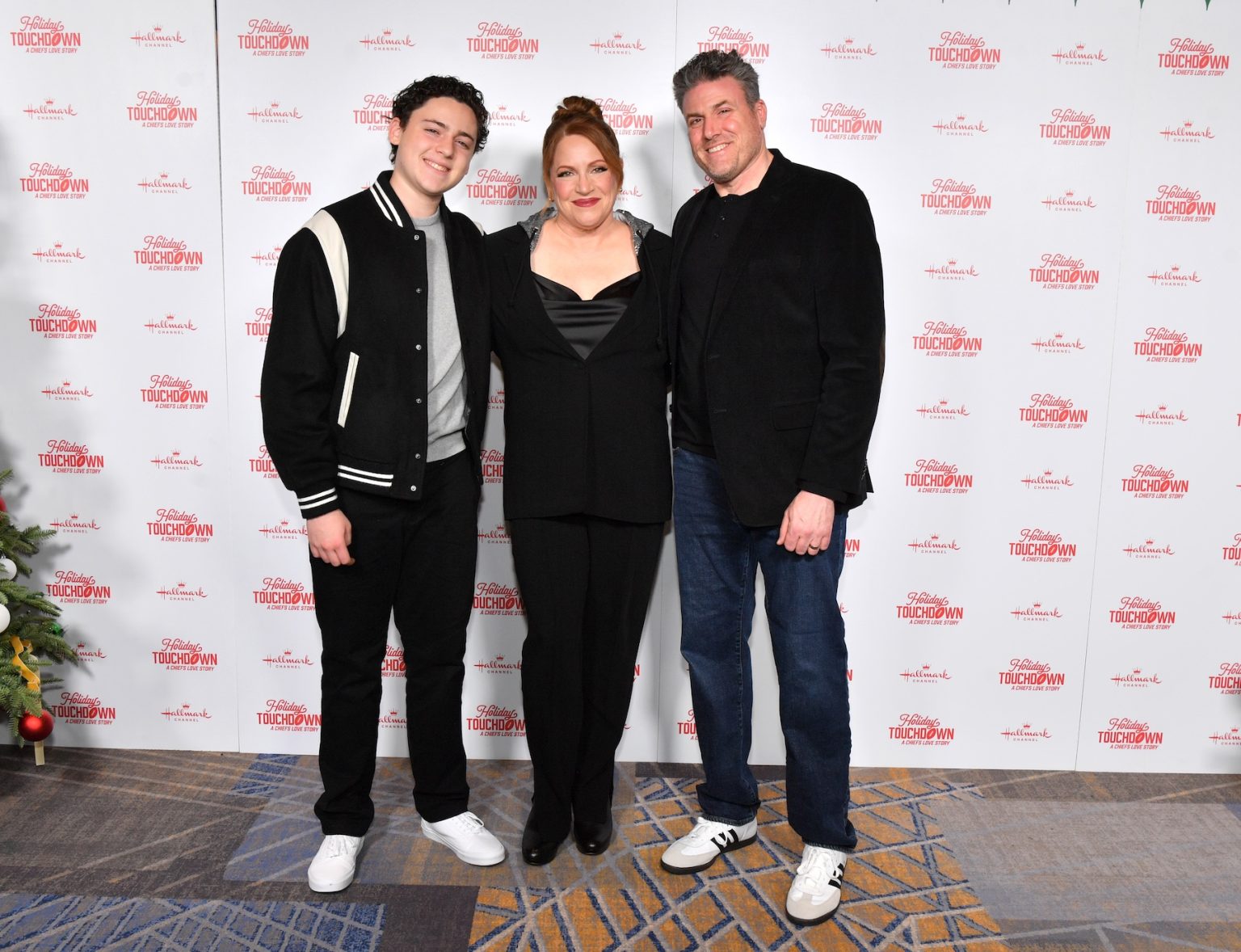 KANSAS CITY, MISSOURI - NOVEMBER 30: Julie Sherman Wolfe (C) attends Hallmark's Premiere Screening of Holiday Touchdown: A Chiefs Love Story on November 30, 2024 in Kansas City, Missouri. (Photo by Jason Davis/Getty Images for Hallmark Media)