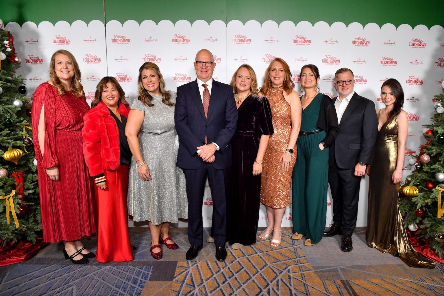 KANSAS CITY, MISSOURI - NOVEMBER 30: (L-R) Jennifer Kramer, Sabrina Wiewel, Samantha DiPippo, Mike Perry, Lisa Hamilton Daly, Annie Howell, Lindsey Roy, Darren Abbott and Candice DiLavore attend the Hallmark's Premiere Screening of Holiday Touchdown: A Chiefs Love Story on November 30, 2024 in Kansas City, Missouri. (Photo by Jason Davis/Getty Images for Hallmark Media)