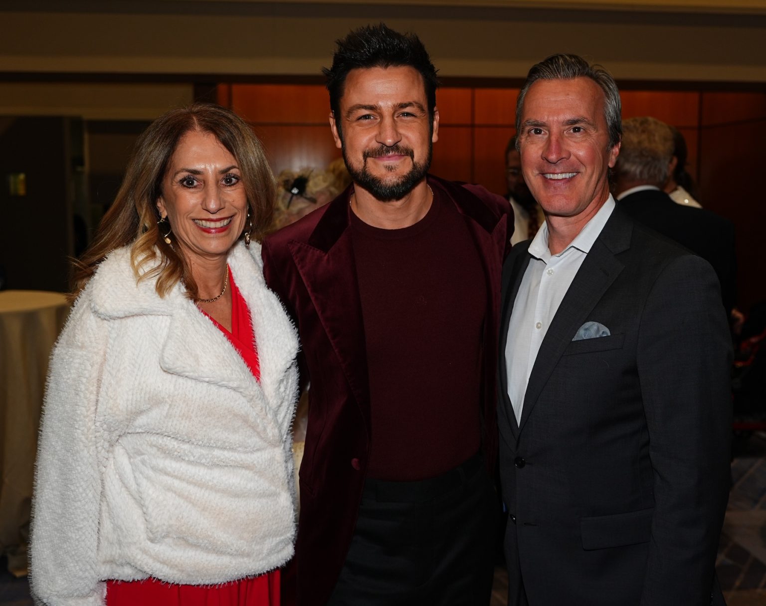 KANSAS CITY, MISSOURI - NOVEMBER 30: Ora Reynolds (L) and Tyler Hynes (C) attend Hallmark's Premiere Screening of Holiday Touchdown: A Chiefs Love Story on November 30, 2024 in Kansas City, Missouri. (Photo by Kyle Rivas/Getty Images for Hallmark Media)