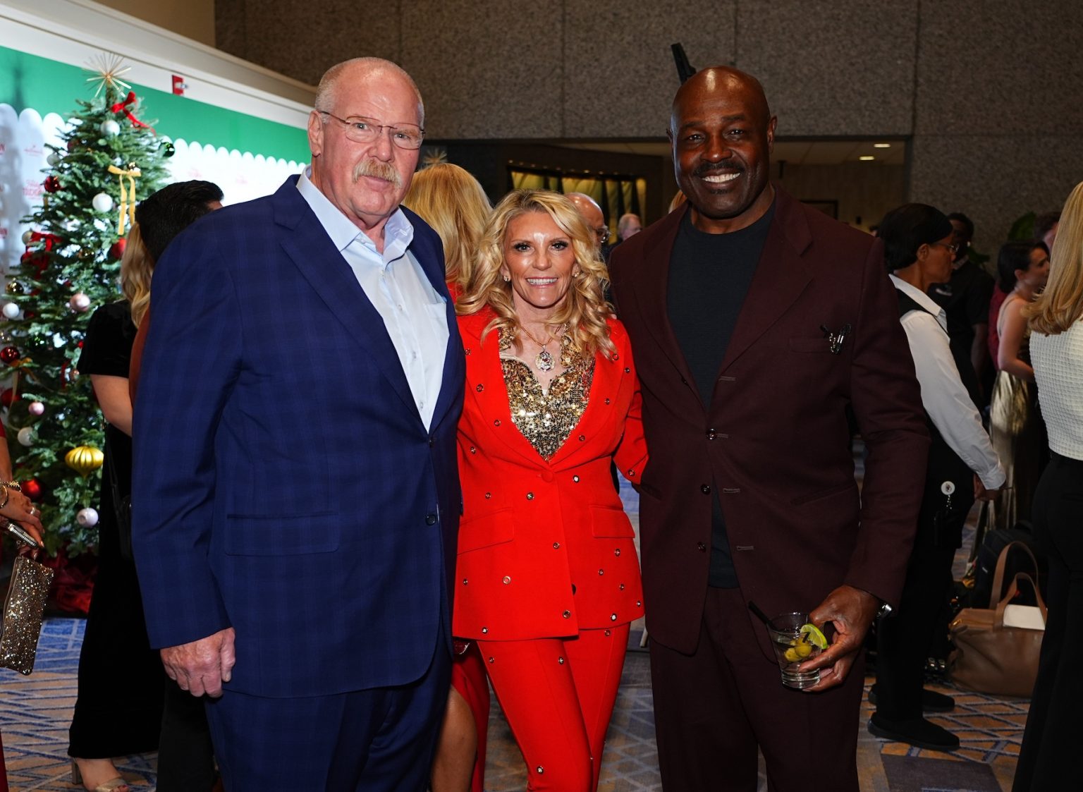 KANSAS CITY, MISSOURI - NOVEMBER 30: (L-R) Andy Reid, Tammy Reid and Christian Okoye attend Hallmark's Premiere Screening of Holiday Touchdown: A Chiefs Love Story on November 30, 2024 in Kansas City, Missouri. (Photo by Kyle Rivas/Getty Images for Hallmark Media)