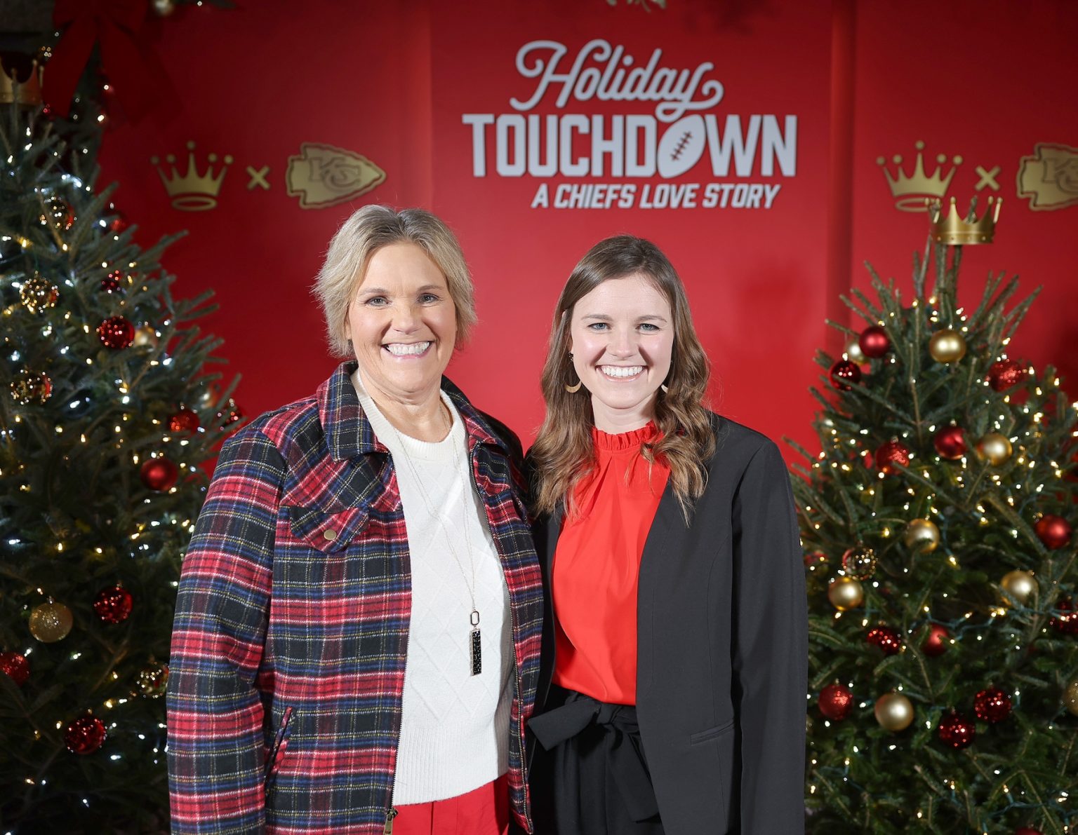 KANSAS CITY, MISSOURI - NOVEMBER 30: (L-R) Cynthia Dowers and Kourtney Swift attend Hallmark's Premiere Screening of Holiday Touchdown: A Chiefs Love Story on November 30, 2024 in Kansas City, Missouri. (Photo by David Eulitt/Getty Images for Hallmark Media)