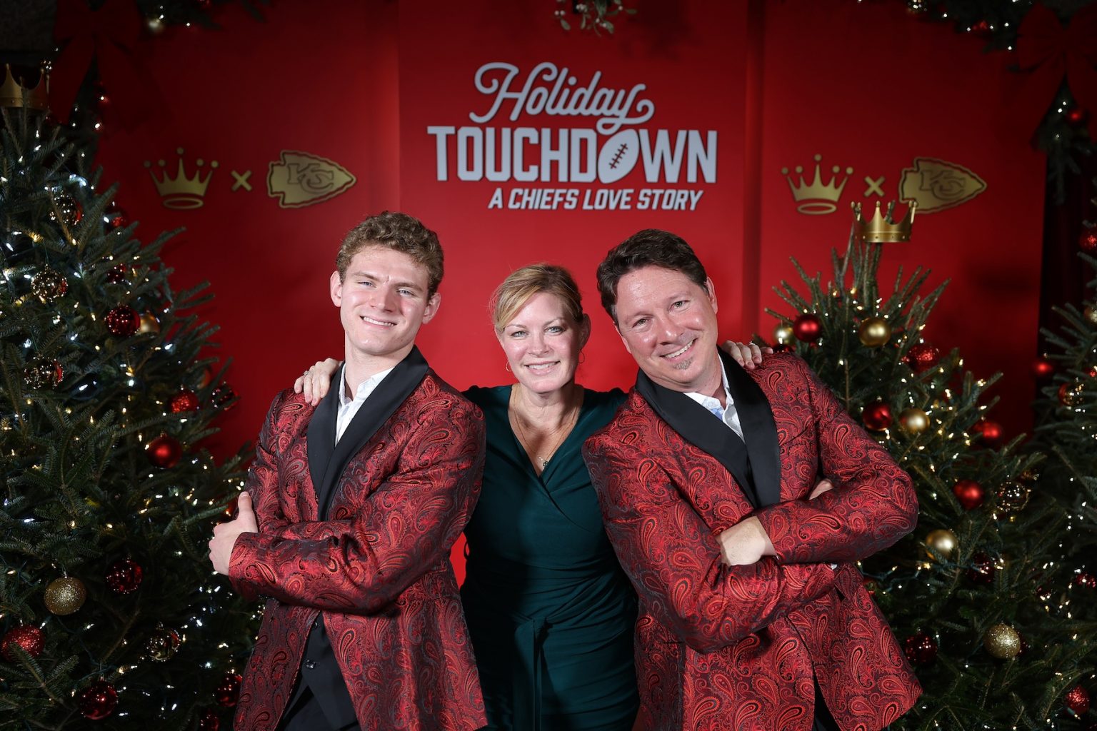 KANSAS CITY, MISSOURI - NOVEMBER 30: Lori Benson Rikert (C) and Dustin Rikert (R) attend during Hallmark's Premiere Screening of Holiday Touchdown: A Chiefs Love Story on November 30, 2024 in Kansas City, Missouri. (Photo by David Eulitt/Getty Images for Hallmark Media)