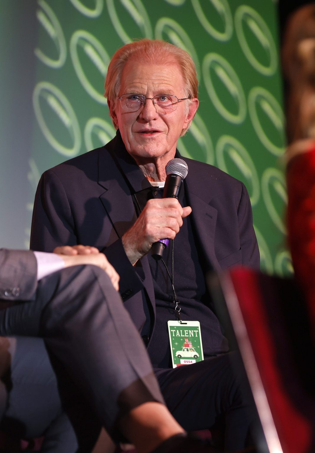 KANSAS CITY, MISSOURI - NOVEMBER 30: Ed Begley Jr. speaks onstage during Hallmark's Premiere Screening of Holiday Touchdown: A Chiefs Love Story on November 30, 2024 in Kansas City, Missouri. (Photo by David Eulitt/Getty Images for Hallmark Media)