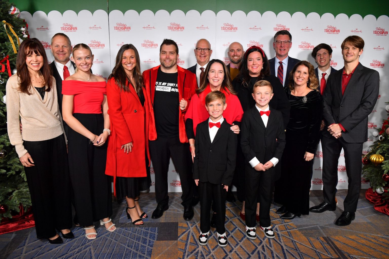 KANSAS CITY, MISSOURI - NOVEMBER 30: Mike Perry, President & CEO, Hallmark (C) attends Hallmark's Premiere Screening of Holiday Touchdown: A Chiefs Love Story on November 30, 2024 in Kansas City, Missouri. (Photo by Jason Davis/Getty Images for Hallmark Media)