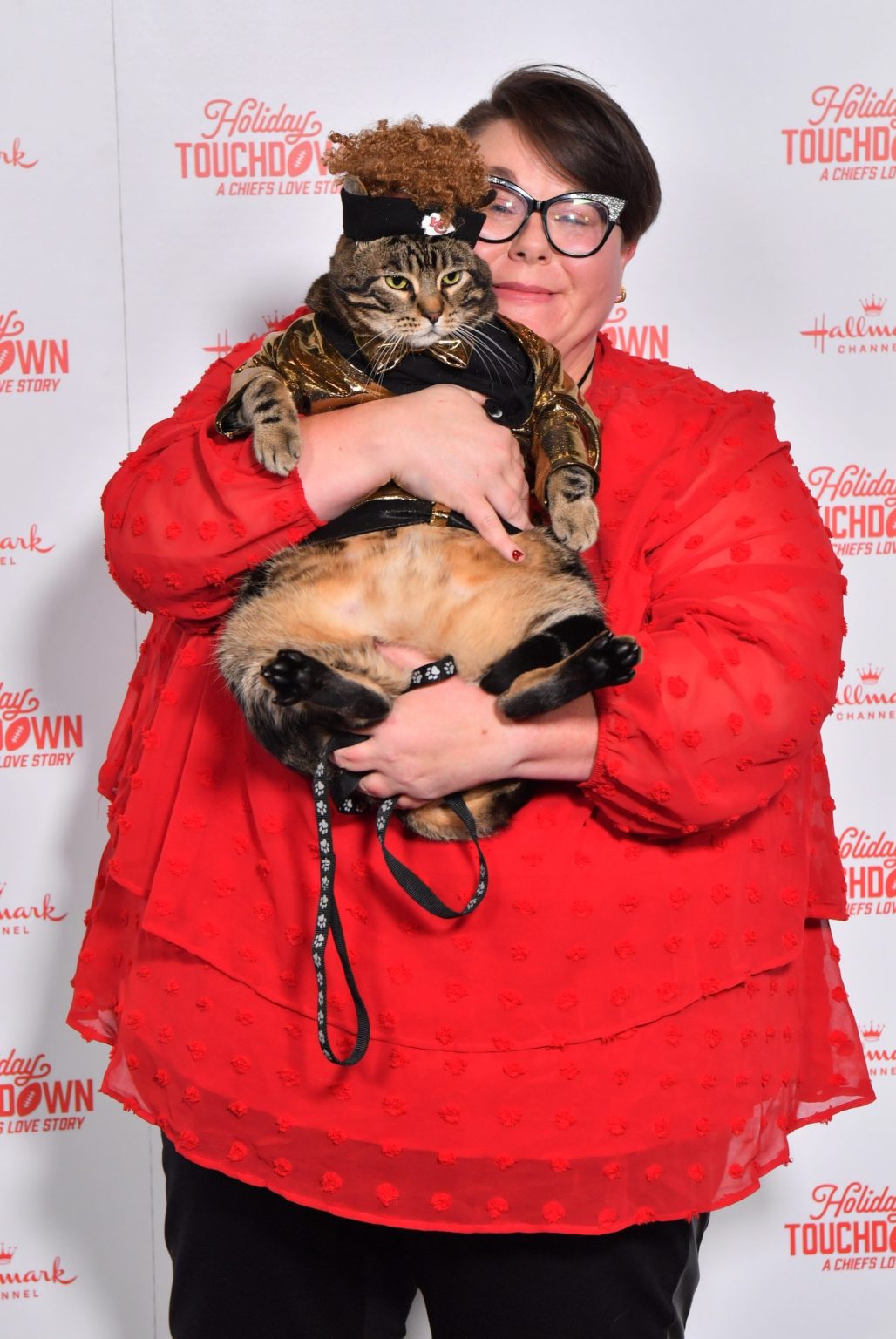 KANSAS CITY, MISSOURI - NOVEMBER 30: Catrick Mahomes the cat and Brandy Peed attend Hallmark's Premiere Screening of Holiday Touchdown: A Chiefs Love Story on November 30, 2024 in Kansas City, Missouri. (Photo by Jason Davis/Getty Images for Hallmark Media)