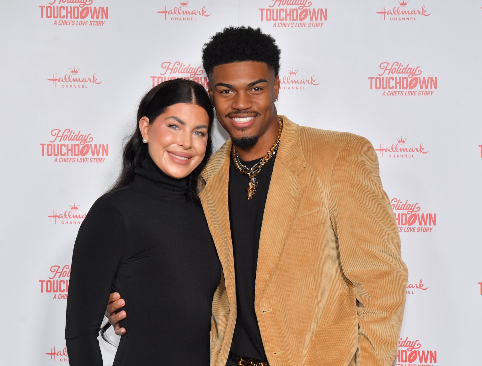 KANSAS CITY, MISSOURI - NOVEMBER 30: (L-R) Emy Moore and Malik Brookins attend Hallmark's Premiere Screening of Holiday Touchdown: A Chiefs Love Story on November 30, 2024 in Kansas City, Missouri. (Photo by Jason Davis/Getty Images for Hallmark Media)