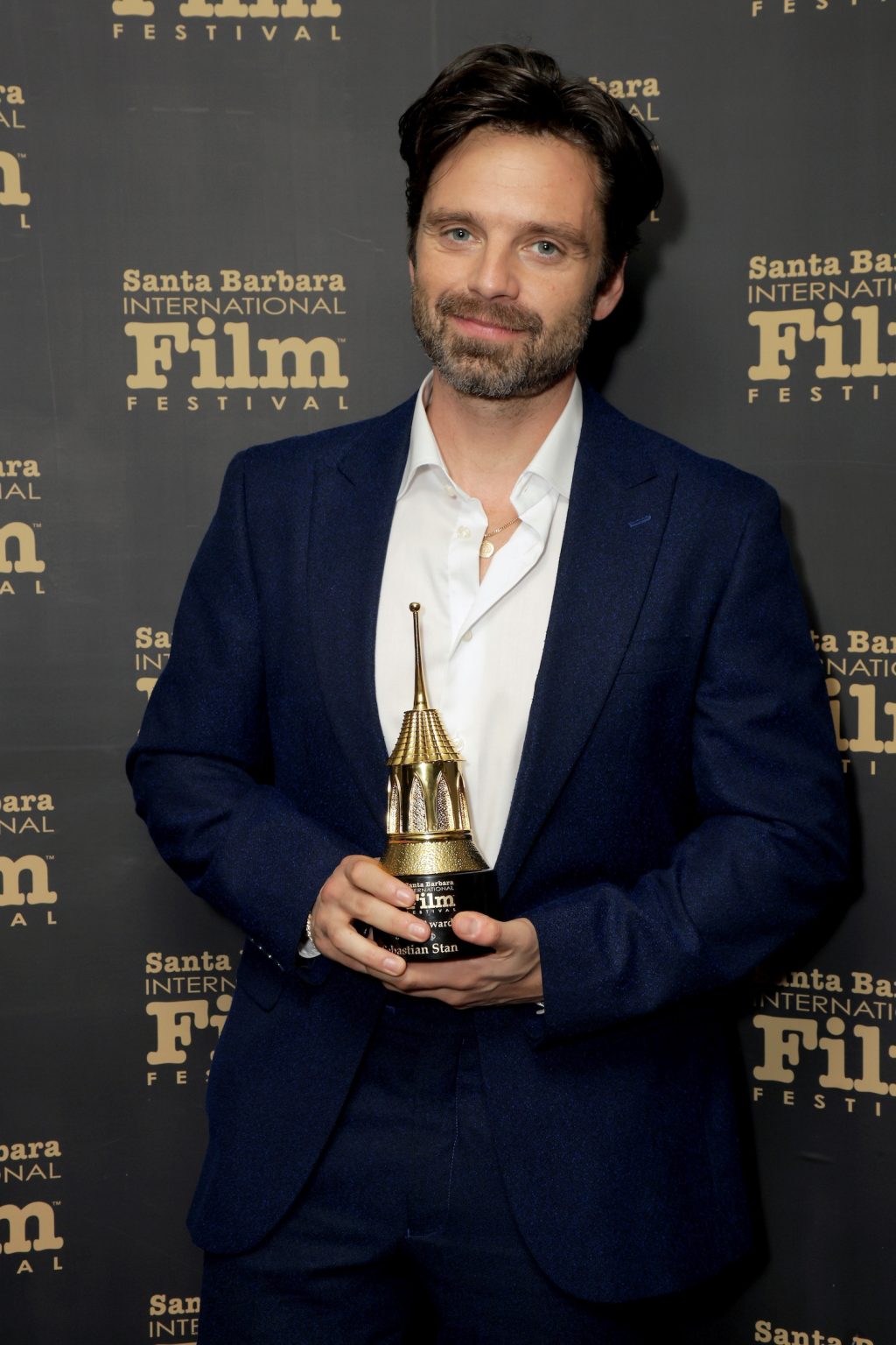 SANTA BARBARA, CALIFORNIA - FEBRUARY 09: Honoree Sebastian Stan poses with the Virtuosos Award during the 40th Santa Barbara International Film Festival at The Arlington Theatre on February 09, 2025 in Santa Barbara, California. (Photo by Rebecca Sapp/Getty Images for Santa Barbara International Film Festival)