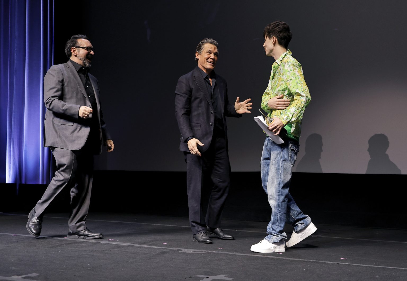 SANTA BARBARA, CALIFORNIA - FEBRUARY 11: (L-R) James Mangold, Josh Brolin and Timothée Chalamet speak onstage at the Arlington Artist Award ceremony during the 40th Santa Barbara International Film Festival at The Arlington Theatre on February 11, 2025 in Santa Barbara, California. (Photo by Tibrina Hobson/Getty Images for Santa Barbara International Film Festival)