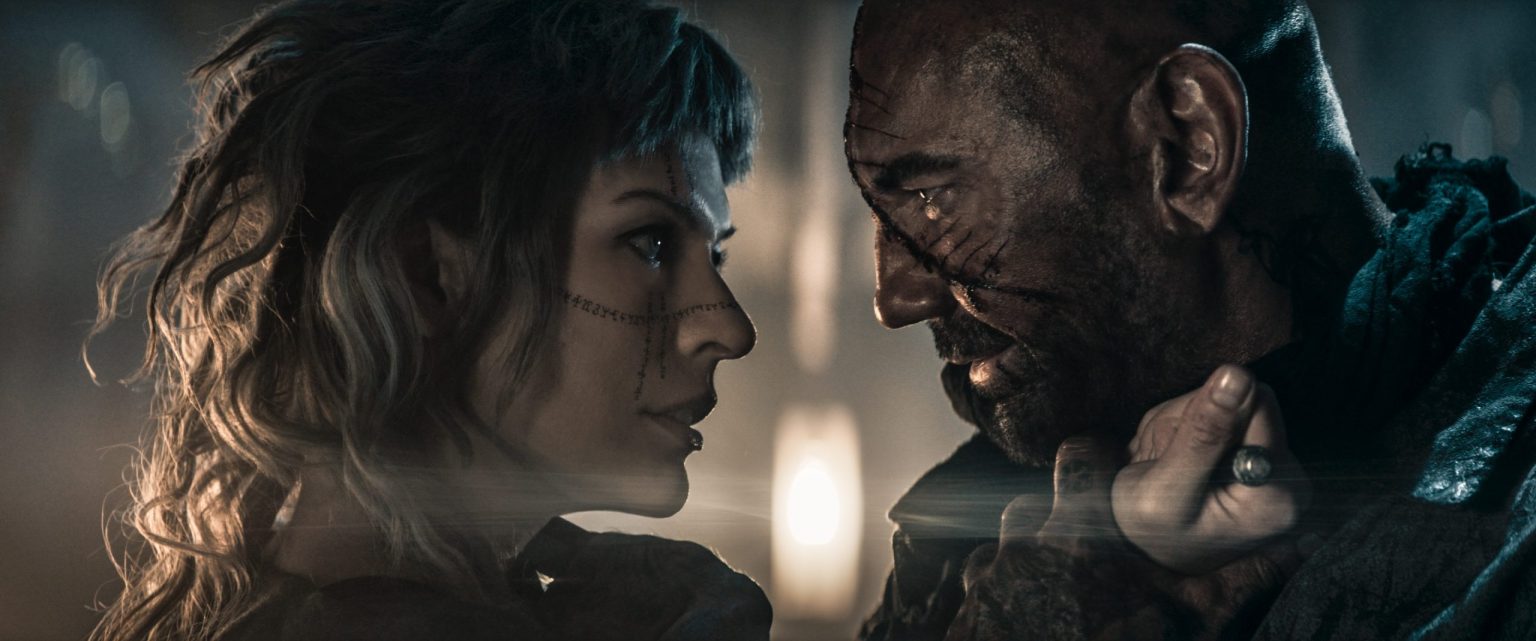 (© Constantin Film / Glen MacPherson) Gray Alys (Milla Jovovich), Boyce (Dave Bautista)