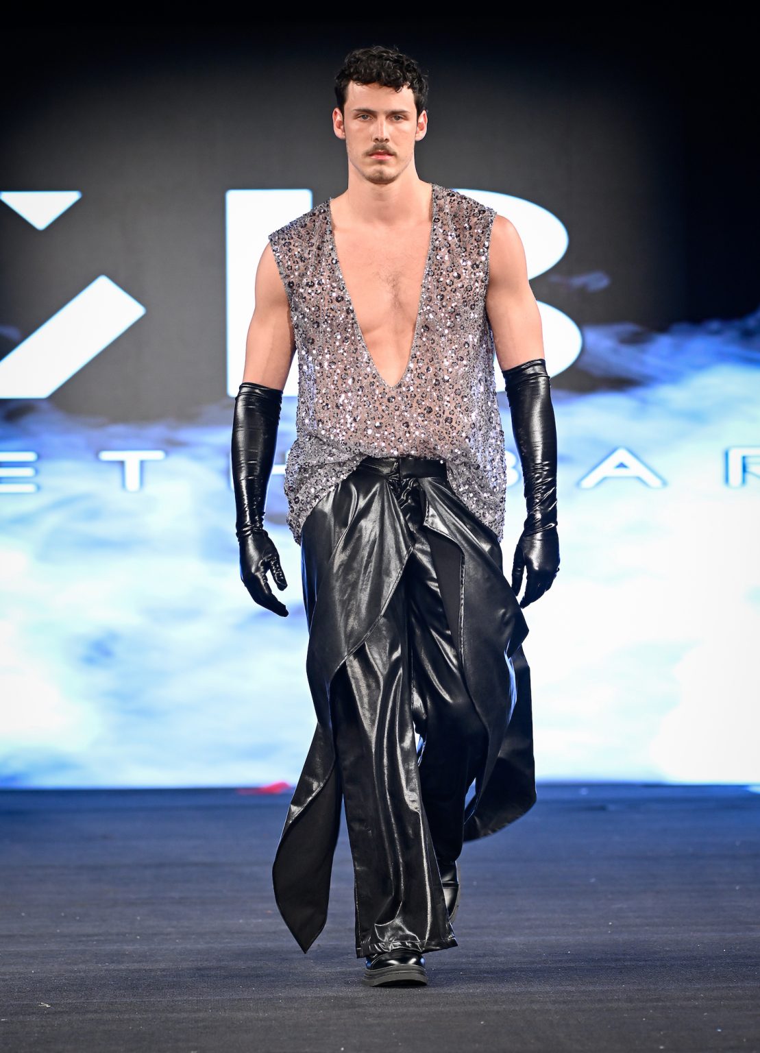 NEW YORK, NEW YORK - FEBRUARY 06: A model walks the runway at the Kenneth Barlis show during New York Fashion Week Powered By Art Hearts Fashion at The Angel Orensanz Foundation on February 06, 2025 in New York City. (Photo by Arun Nevader/Getty Images for Art Hearts Fashion)