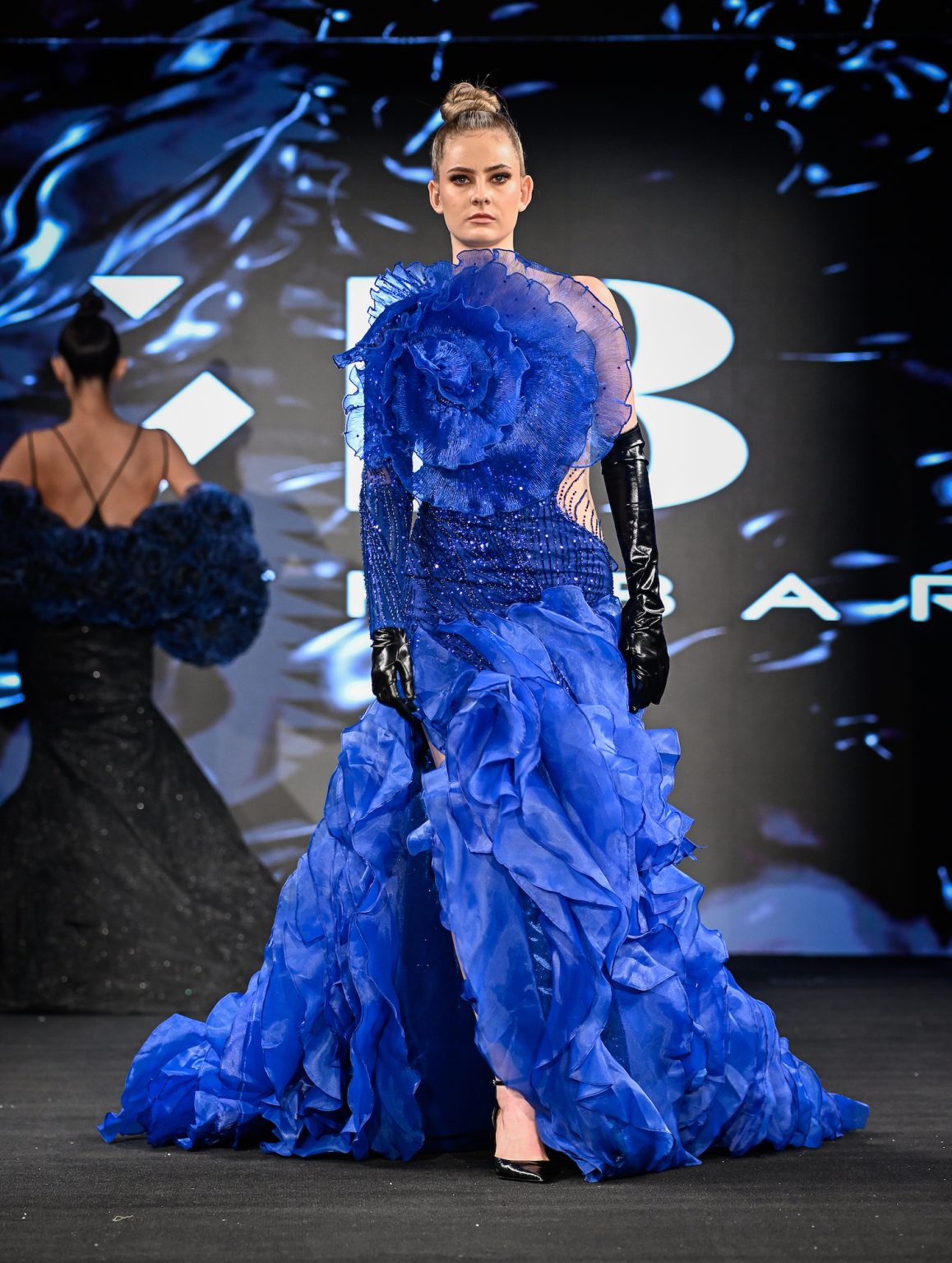 NEW YORK, NEW YORK - FEBRUARY 06: A model walks the runway at the Kenneth Barlis show during New York Fashion Week Powered By Art Hearts Fashion at The Angel Orensanz Foundation on February 06, 2025 in New York City. (Photo by Arun Nevader/Getty Images for Art Hearts Fashion)