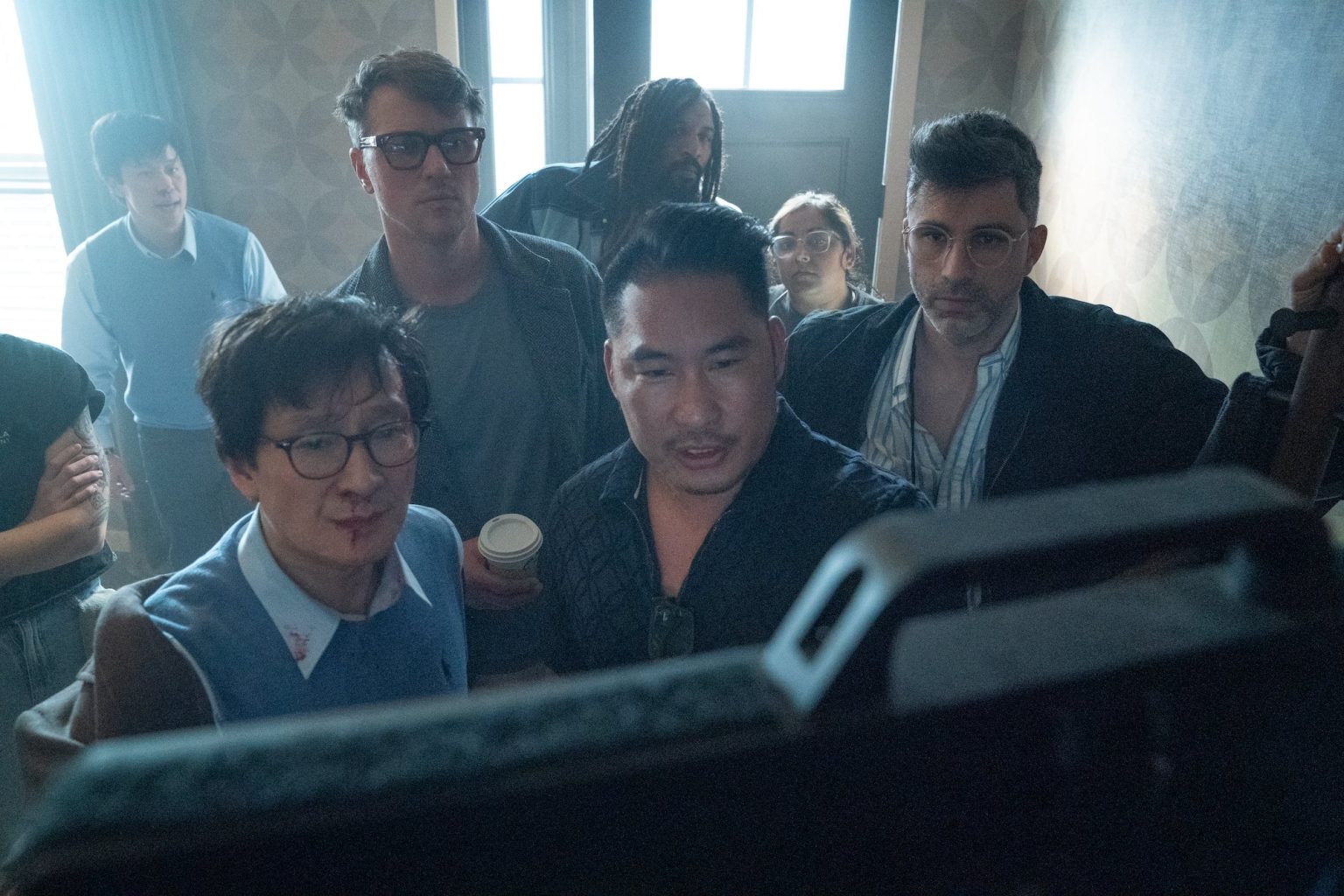 (from left, foreground) Ke Huy Quan, producer Guy Danella, director Jonathan Eusebio and stunt designer & coordinator Can Aydin on the set of ove Hurts.