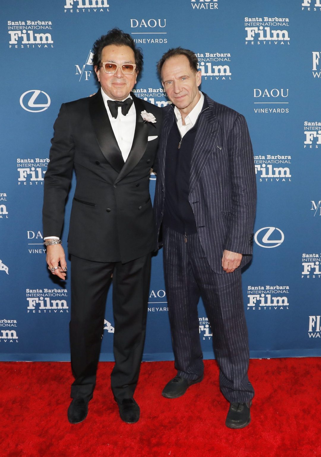 SANTA BARBARA, CALIFORNIA - FEBRUARY 06: SBIFF Executive Director Roger Durling and honoree Ralph Fiennes attends the Outstanding Performer of the Year Award ceremony during the 40th Santa Barbara International Film Festival at Arlington Theatre on February 06, 2025 in Santa Barbara, California. (Photo by Tibrina Hobson/Getty Images for Santa Barbara International Film Festival)