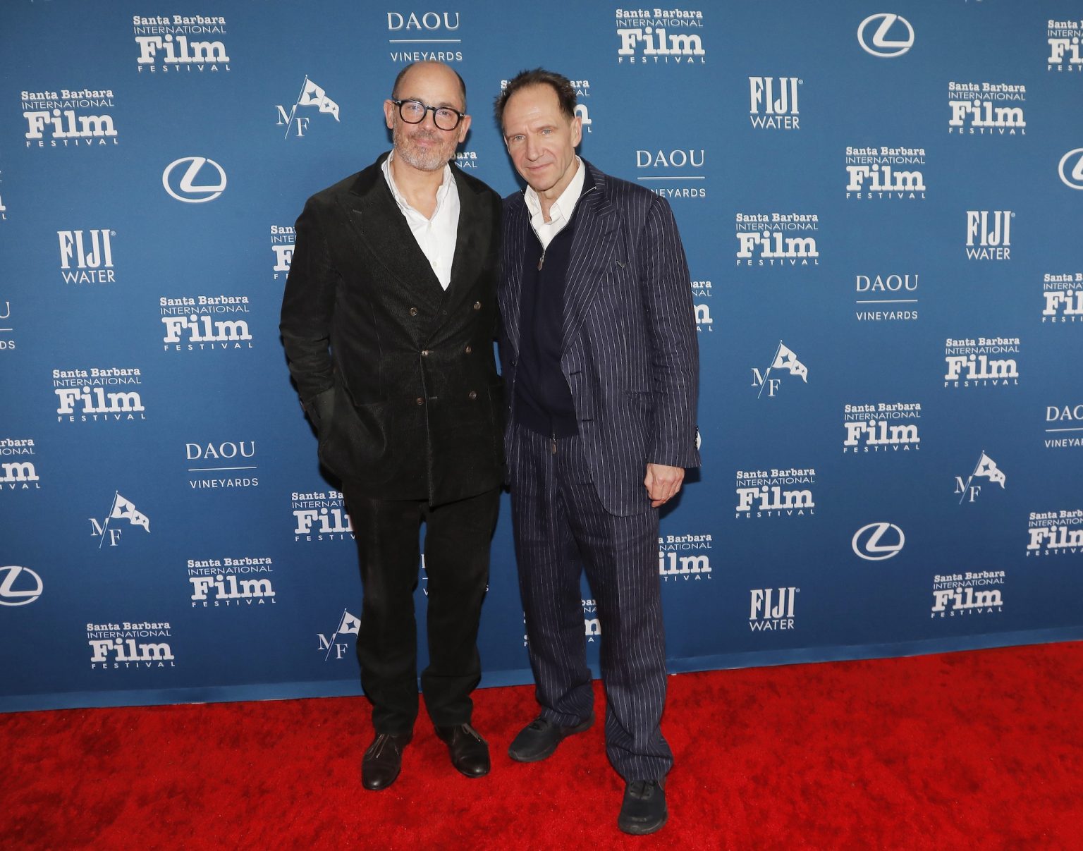 SANTA BARBARA, CALIFORNIA - FEBRUARY 06: Edward Berger and honoree Ralph Fiennes attends the Outstanding Performer of the Year Award ceremony during the 40th Santa Barbara International Film Festival at Arlington Theatre on February 06, 2025 in Santa Barbara, California. (Photo by Tibrina Hobson/Getty Images for Santa Barbara International Film Festival)