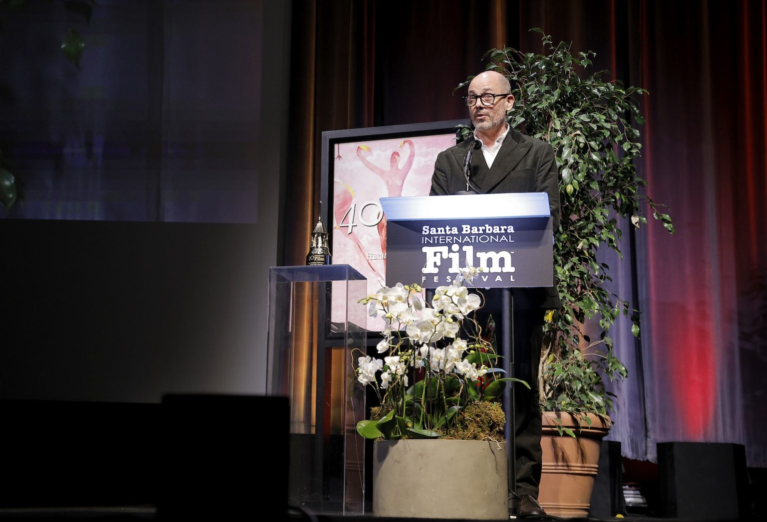 SANTA BARBARA, CALIFORNIA - FEBRUARY 06: Edward Berger presents Ralph Fiennes with the Outstanding Performer of the Year Award ceremony during the 40th Santa Barbara International Film Festival at Arlington Theatre on February 06, 2025 in Santa Barbara, California. (Photo by Tibrina Hobson/Getty Images for Santa Barbara International Film Festival)