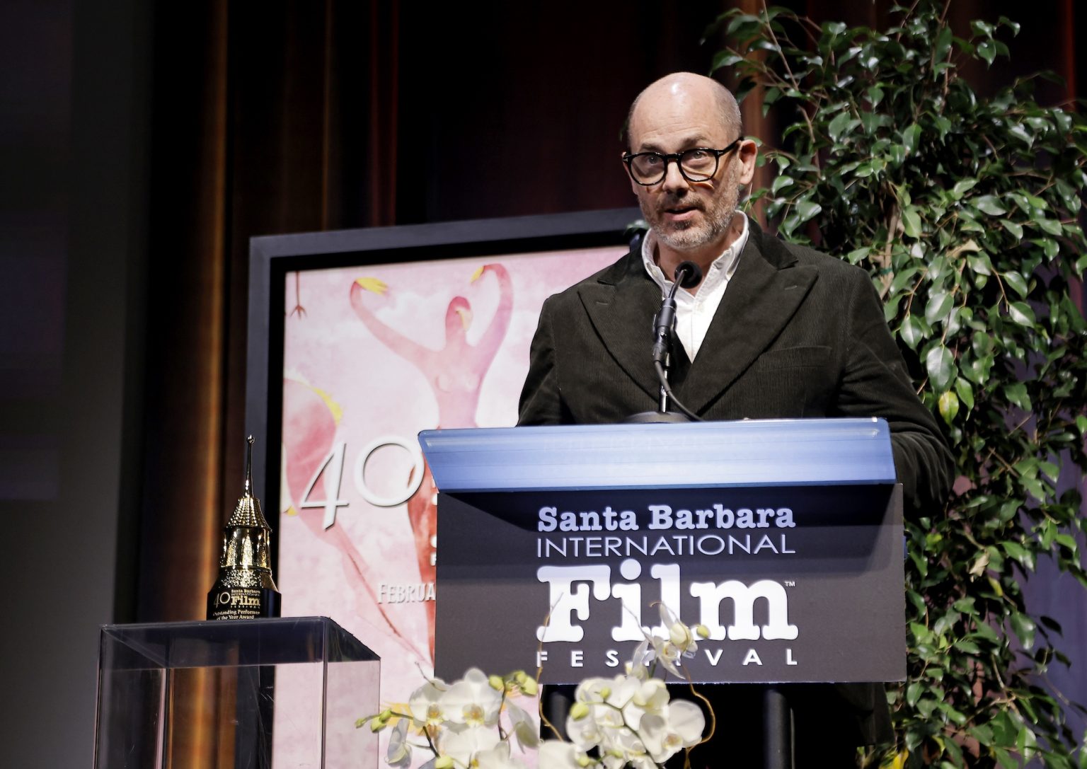 SANTA BARBARA, CALIFORNIA - FEBRUARY 06: Edward Berger presents Ralph Fiennes with the Outstanding Performer of the Year Award ceremony during the 40th Santa Barbara International Film Festival at Arlington Theatre on February 06, 2025 in Santa Barbara, California. (Photo by Tibrina Hobson/Getty Images for Santa Barbara International Film Festival)