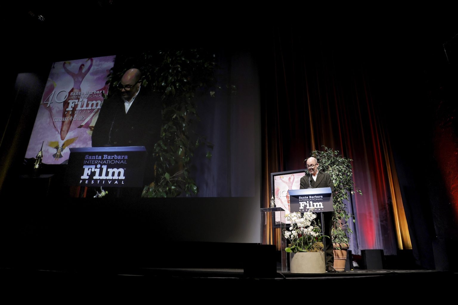 SANTA BARBARA, CALIFORNIA - FEBRUARY 06: Edward Berger presents Ralph Fiennes with the Outstanding Performer of the Year Award ceremony during the 40th Santa Barbara International Film Festival at Arlington Theatre on February 06, 2025 in Santa Barbara, California. (Photo by Tibrina Hobson/Getty Images for Santa Barbara International Film Festival)