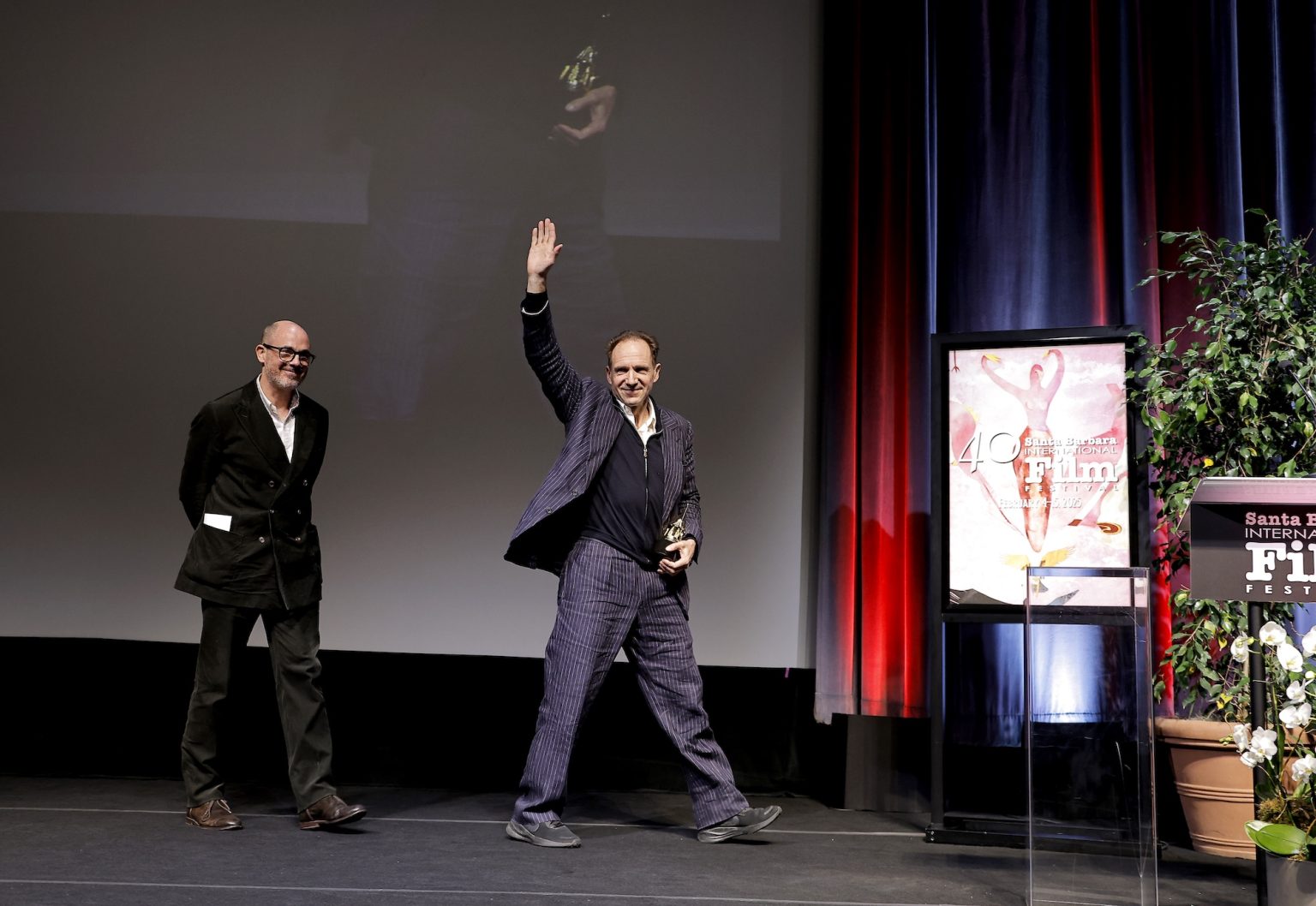 SANTA BARBARA, CALIFORNIA - FEBRUARY 06: Edward Berger presents Ralph Fiennes with the Outstanding Performer of the Year Award ceremony during the 40th Santa Barbara International Film Festival at Arlington Theatre on February 06, 2025 in Santa Barbara, California. (Photo by Tibrina Hobson/Getty Images for Santa Barbara International Film Festival)