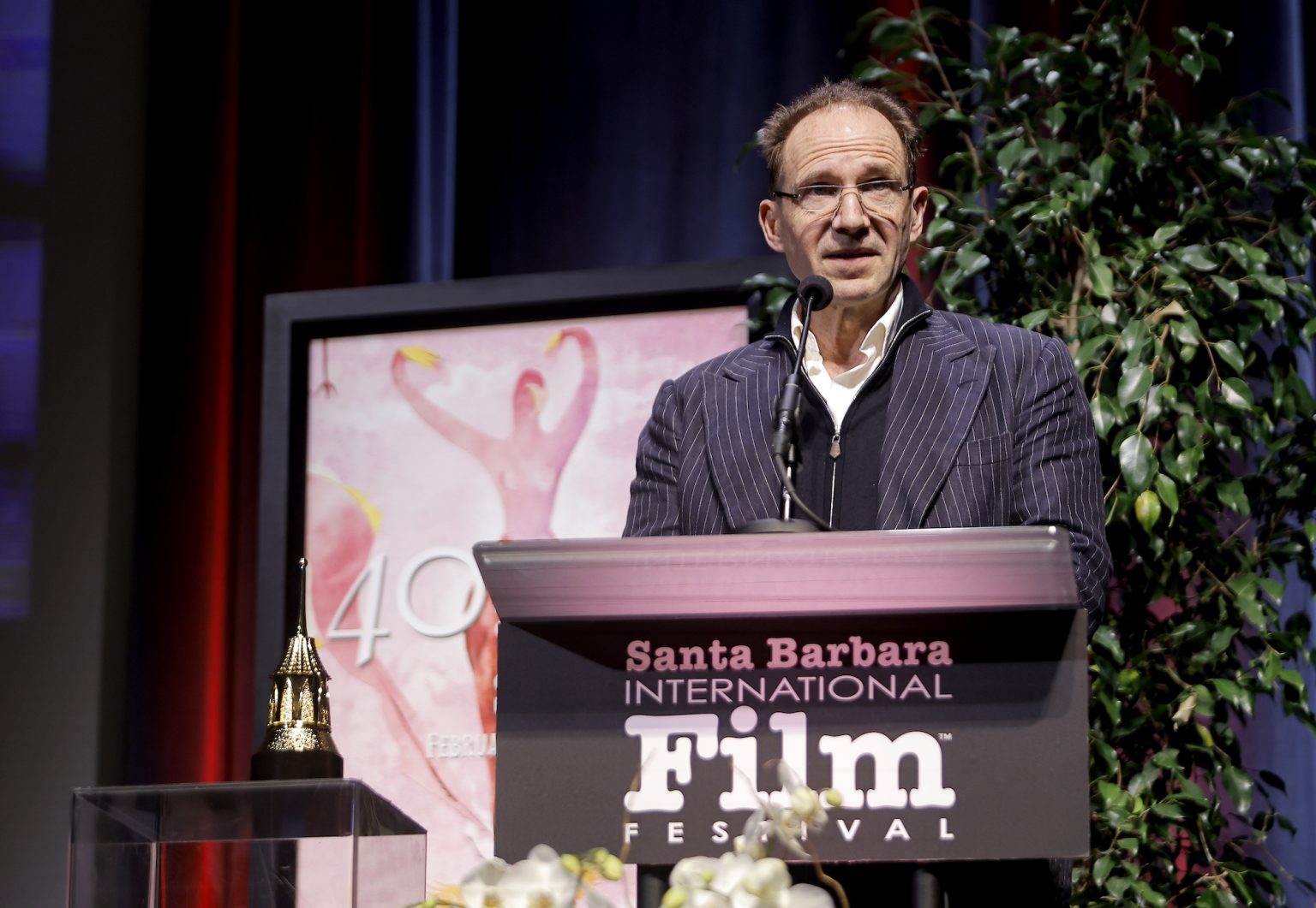 SANTA BARBARA, CALIFORNIA - FEBRUARY 06: Honoree Ralph Fiennes receives the Outstanding Performer of the Year Award ceremony during the 40th Santa Barbara International Film Festival at Arlington Theatre on February 06, 2025 in Santa Barbara, California. (Photo by Tibrina Hobson/Getty Images for Santa Barbara International Film Festival)