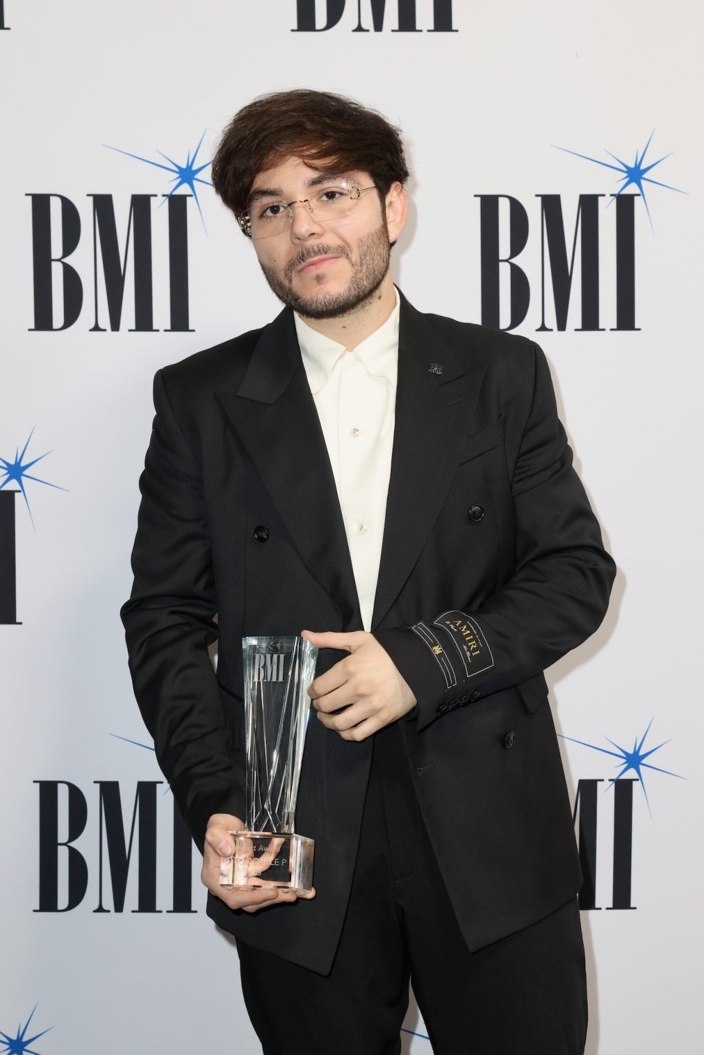 MIAMI, FLORIDA - MARCH 06: Tito Double P attends the BMI Latin Awards on March 06, 2025 in Miami, Florida. (Photo by Alexander Tamargo/Getty Images for BMI)