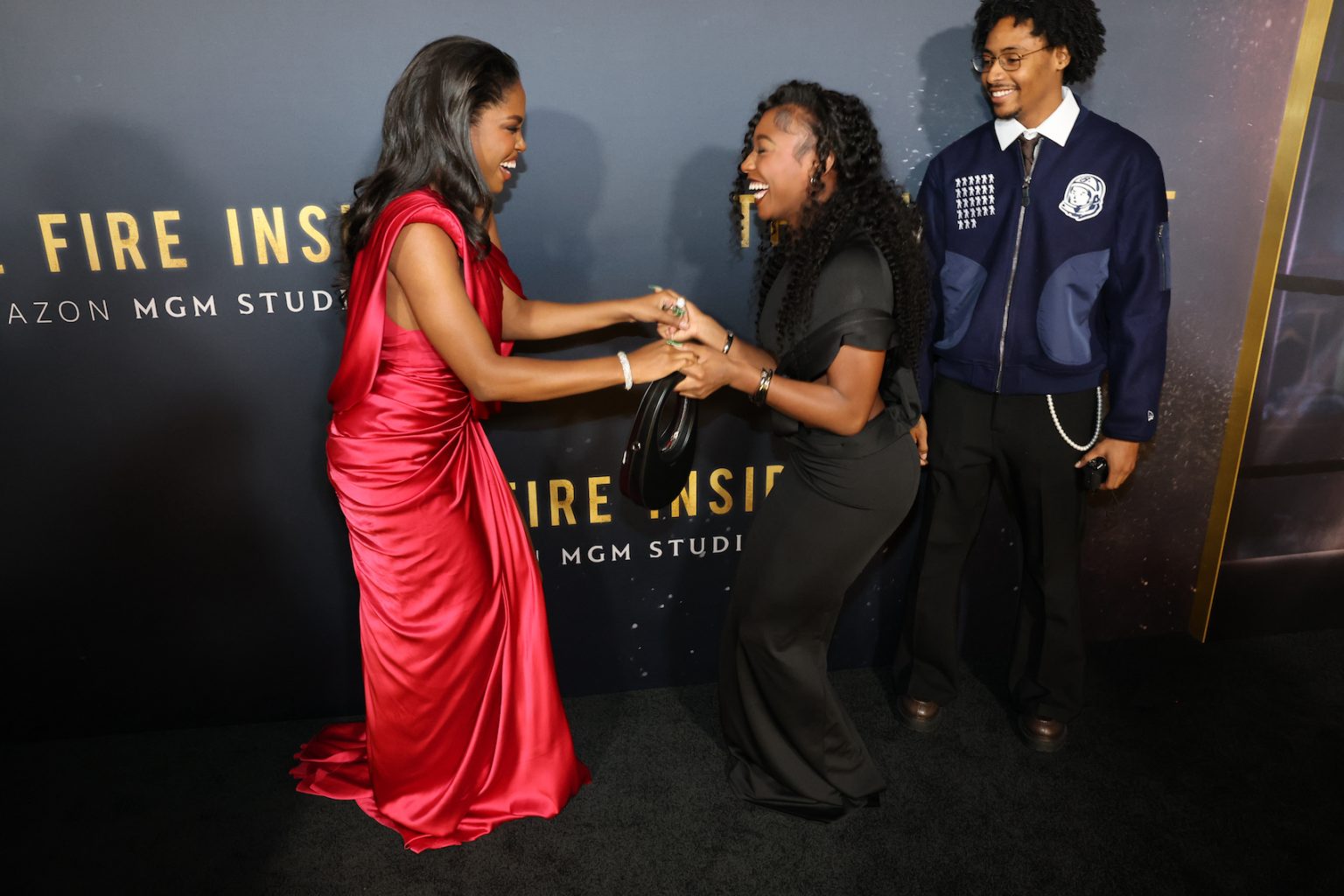 LOS ANGELES, CALIFORNIA - DECEMBER 04: Ryan Destiny, Serena Page and Kordell Beckham attend the Los Angeles Premiere Of "The Fire Inside" at DGA Theater Complex on December 04, 2024 in Los Angeles, California. (Photo by Eric Charbonneau/Amazon MGM Studios via Getty Images)